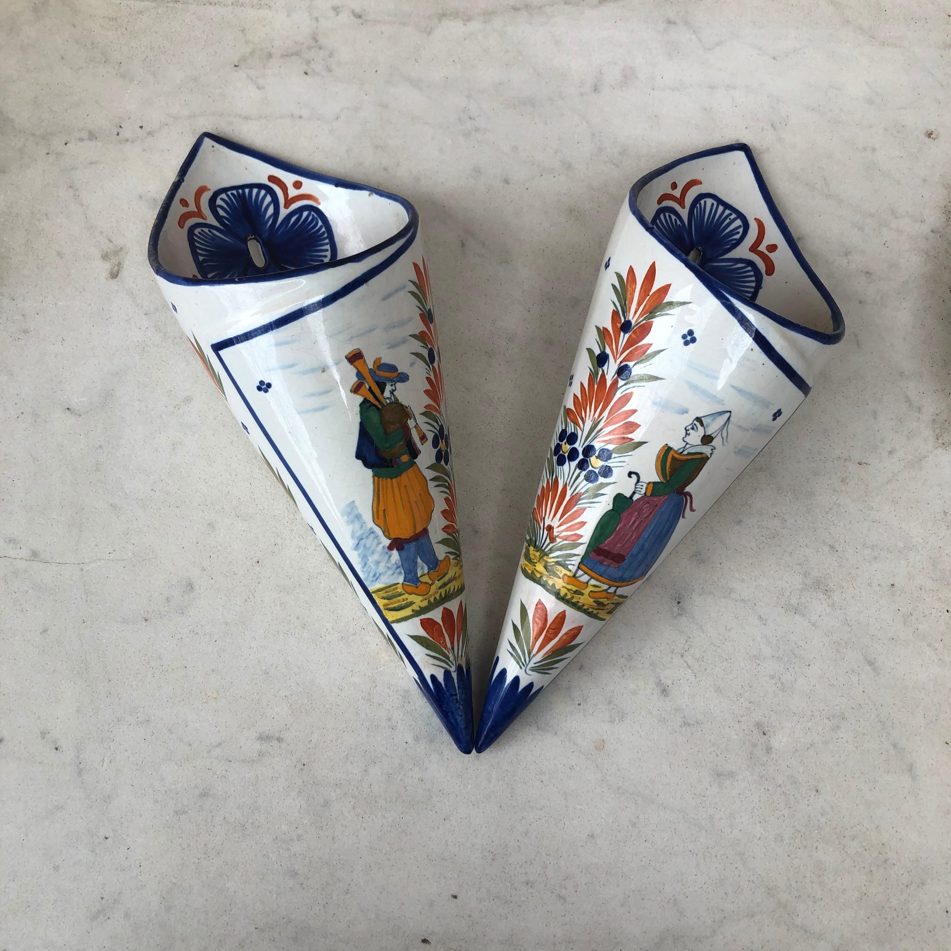 Pair of French Faience wall pocket signed Henriot Quimper, circa 1900.
Hand painted with a couple of bretons and flowers.