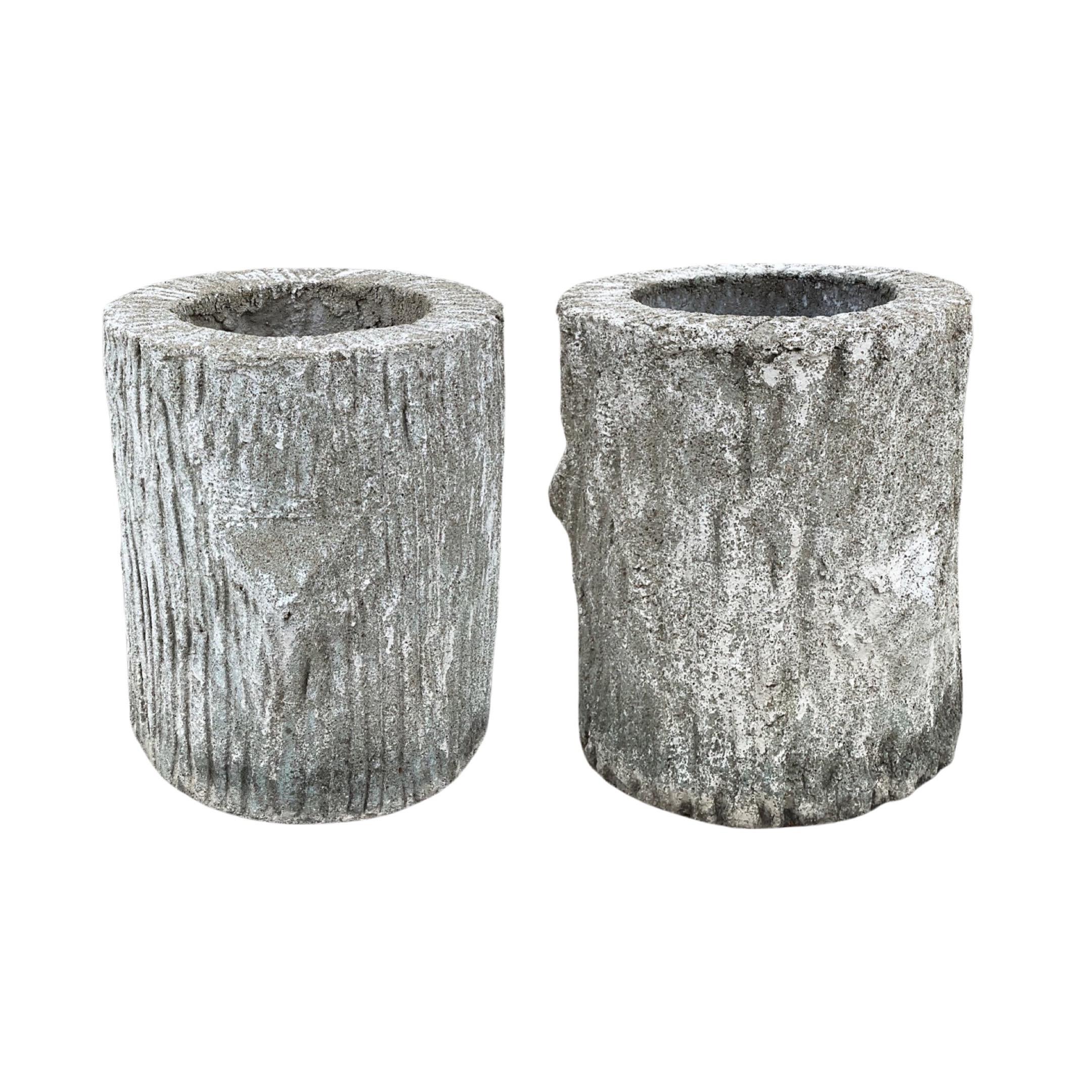 This pair of French faux bois composite planters is a unique and beautiful way to add greenery to your outdoor living space. Each planter is made of a fiberglass and stone composite, durable and lightweight, and sold as a pair. Add color and life to