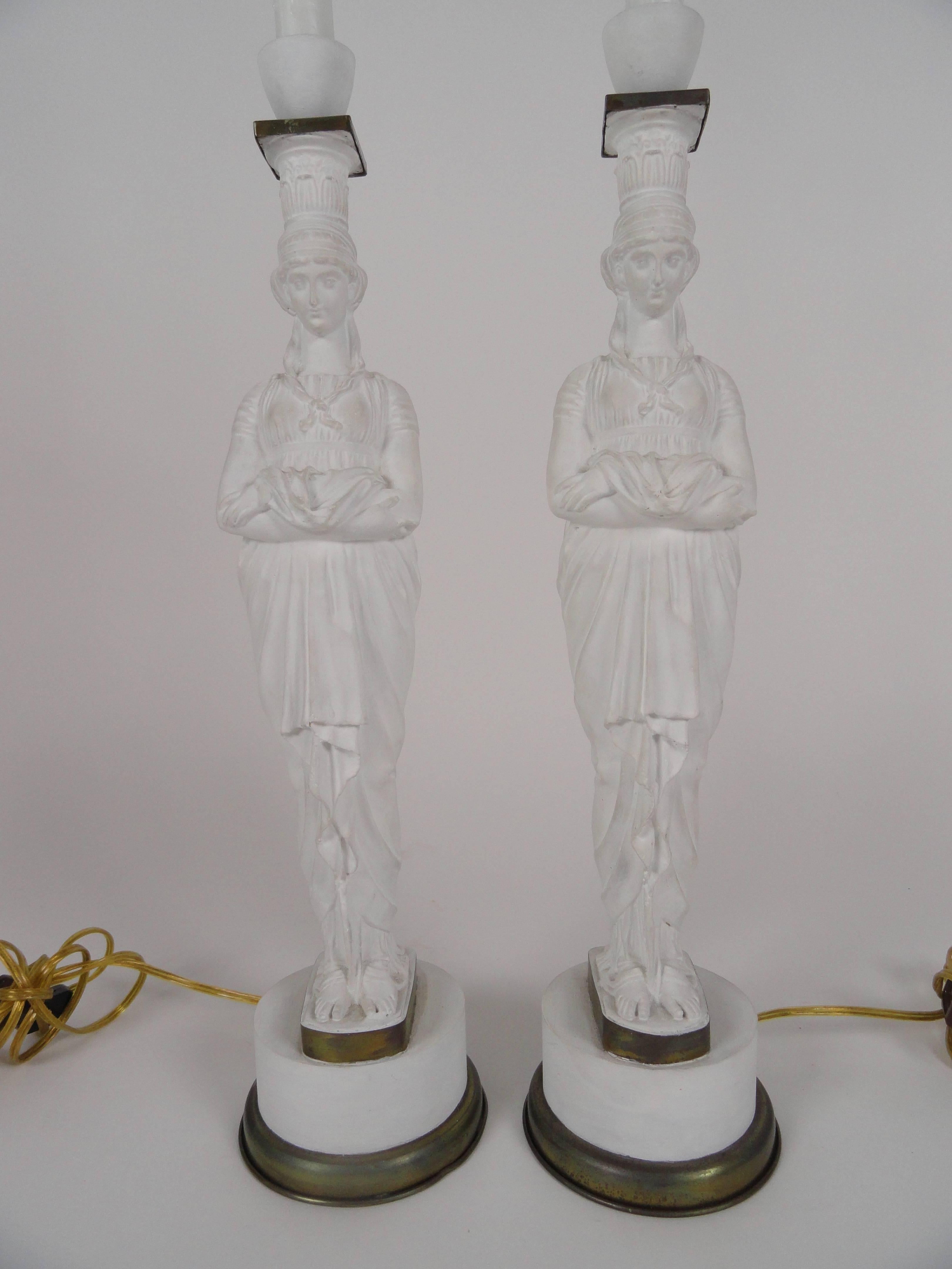Pair of French metal lamps modeled after the figure supports at the Temple of Diana at the Acropolis site in Athens.
Finely carved with fine features and beautiful draping on the figures. These are metal and fairly heavy lamps.
Rewired with inline