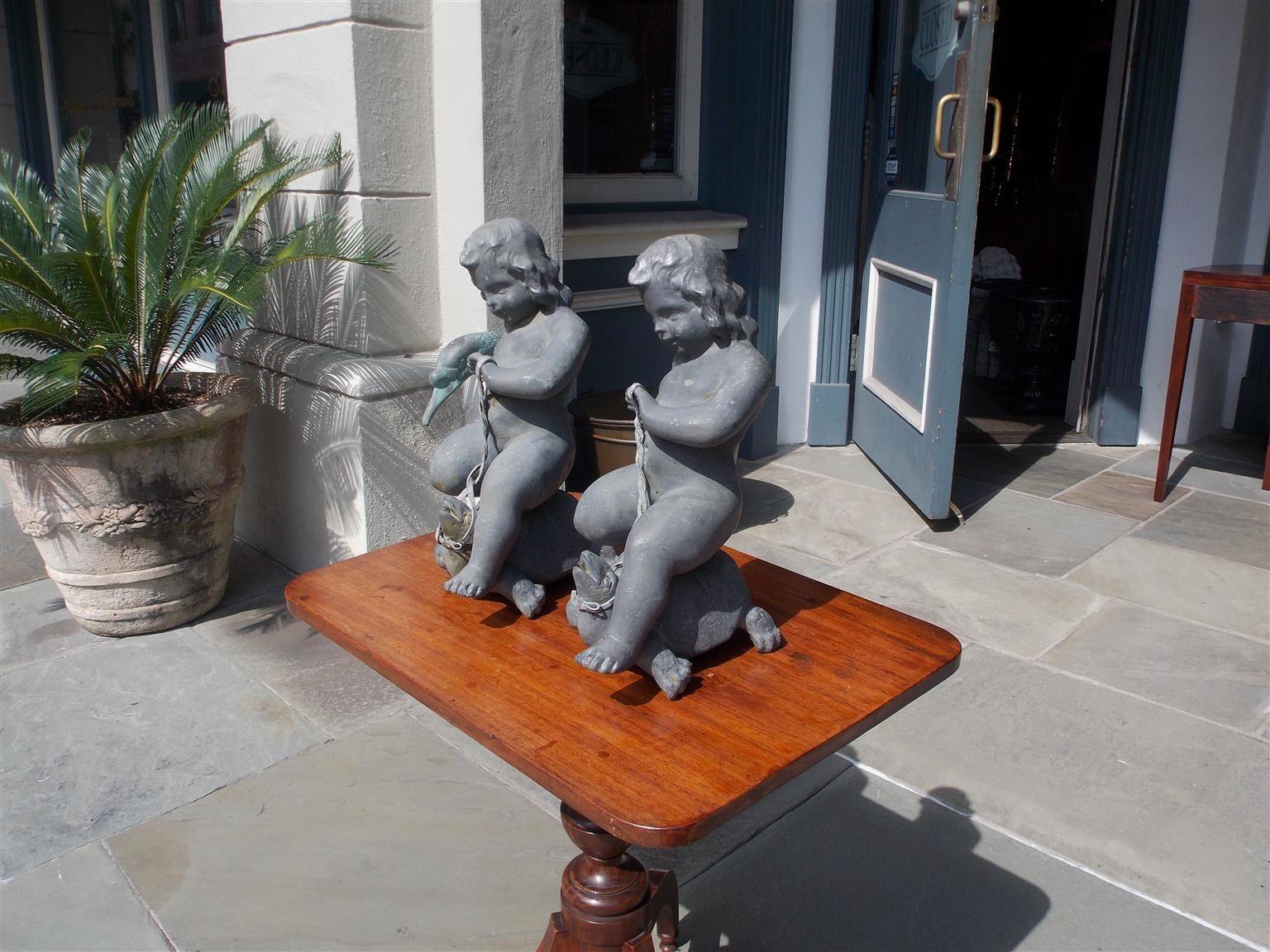 Pair of French Figural Cherub Form Lead Fountains Riding on Turtles, Circa 1860 In Excellent Condition For Sale In Hollywood, SC