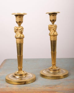 Pareja de candelabros imperio franceses dorados al fuego