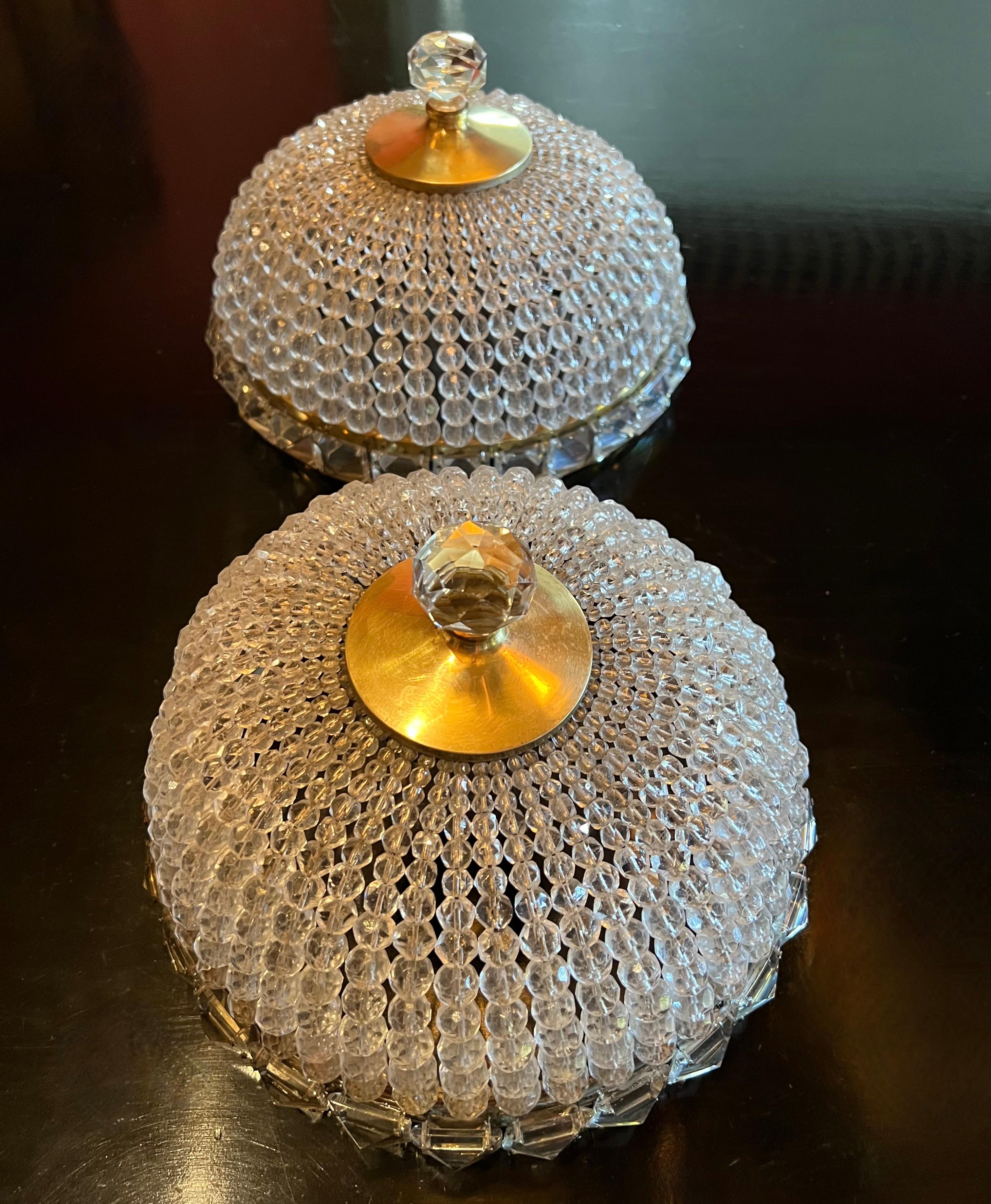 Very stylish and glamorous French crystal fixture with real crystals strung in a dome with blocks of crystal surrounding at the bases perimeter. We have polished the cap and left some of the patination on the underside. the Dome does not include an