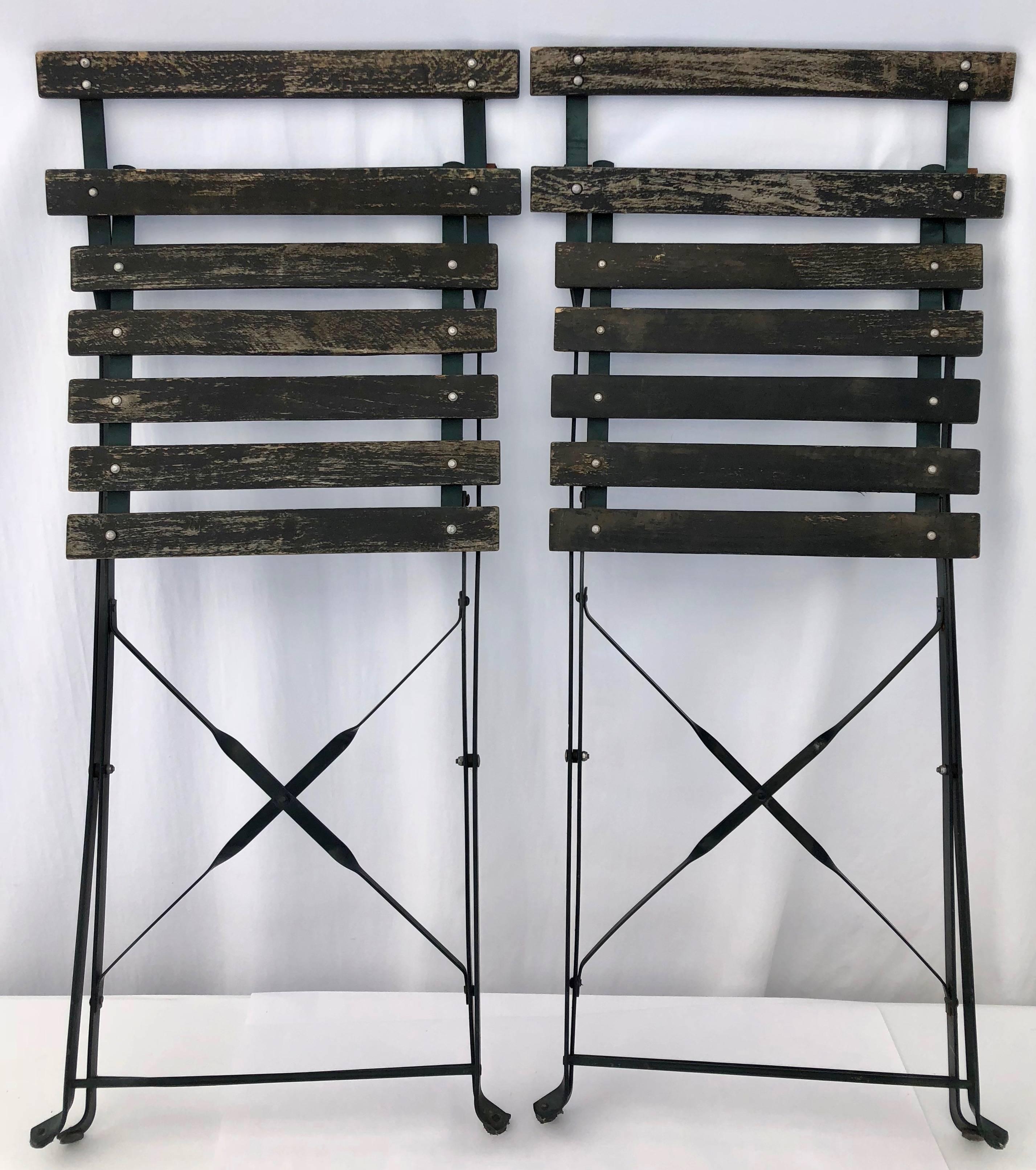These are a charming pair of French foldable garden chairs in a great green. They are made of wood and metal and sturdy although lightweight and easy to carry. They are from the 1950s and have a great patina on them.

Size:
Folded: W 16.5, D 2, H