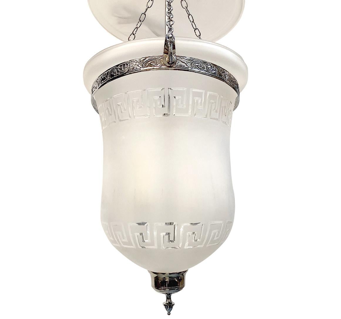A pair of circa 1940s reverse-etched frosted glass lanterns with nickel-plated body and three interior lights. Sold individually.

Measurements:
Diameter 13
