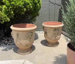 Pair of French Garden Pots from Anduze with Antiqued Patina, Mascarons and Swags