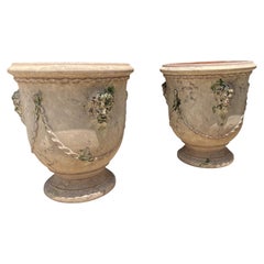 Pair of French Garden Pots from Anduze with Antiqued Patina, Mascarons and Swags