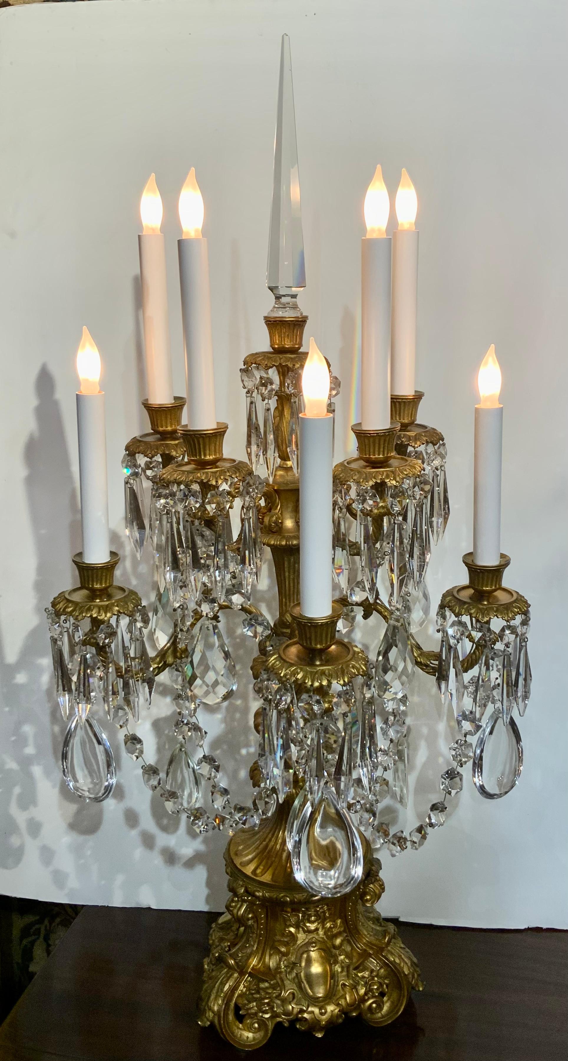 Fourth quarter of the 19th century, these eight light candelabra with gilt bases
Raised on scrolled feet, decorated with scroll-framed panels and acanthus 
Leaves, supporting leaf molded and rope twist scrolled candle arms terminating 
In fluted
