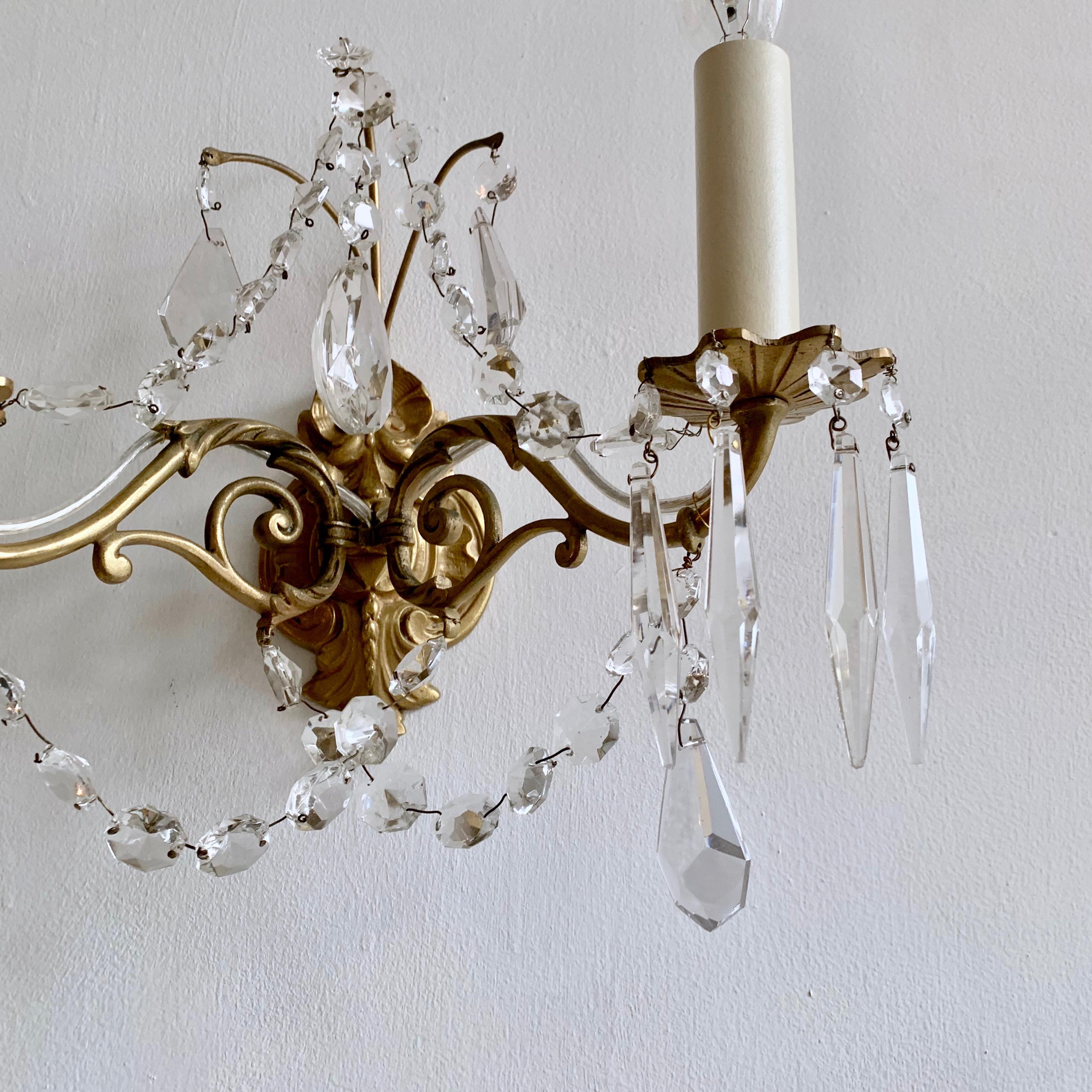 Early 20th Century Pair of French Gilded Ornate Lamp Brass Wall Lights with Crystal Swag Drops