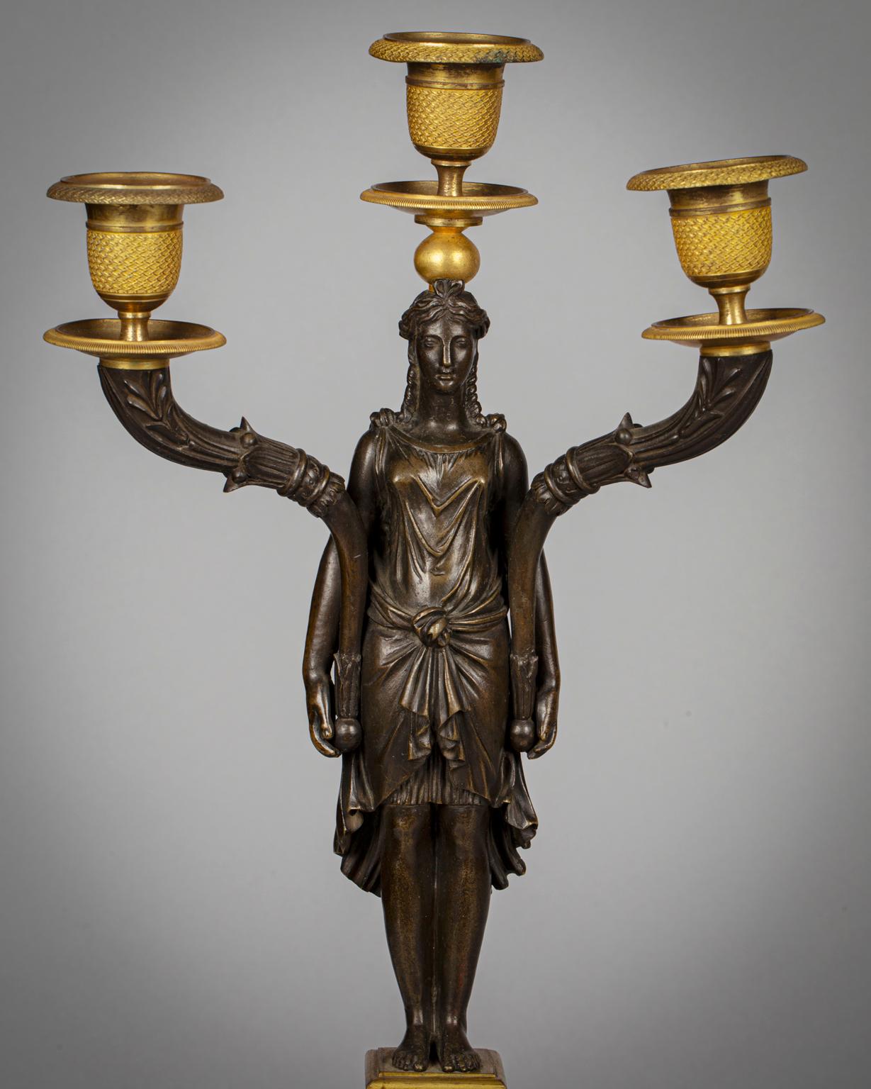 Pair of French Gilt and Patinated Bronze Figural Three-Lite Candelabra In Good Condition For Sale In New York, NY
