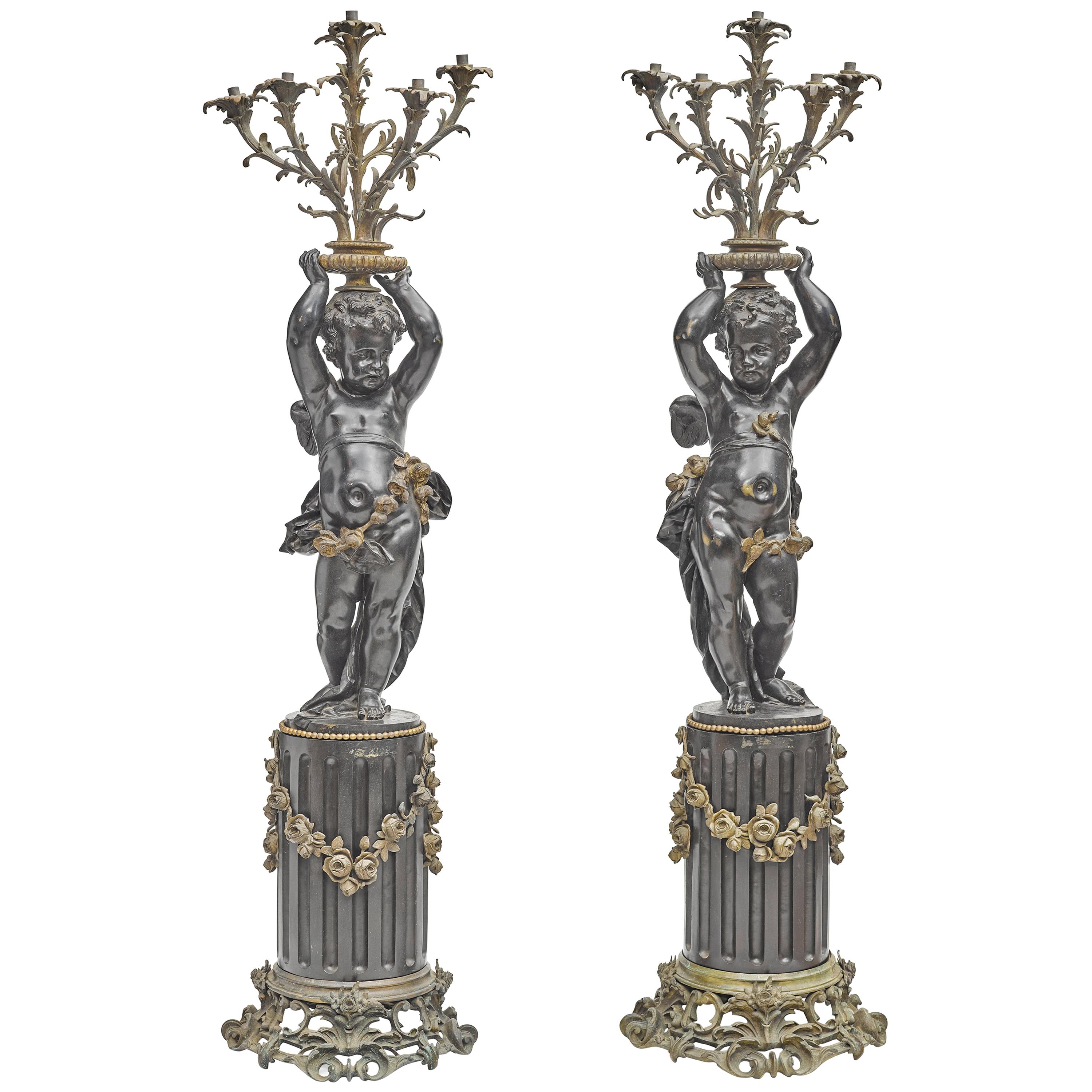 Pair of French Gilt and Patinated Bronze Figural Torchieres