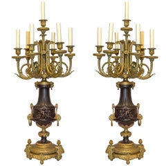Pair of French Gilt Bronze and Patinated Bronze Seven-Light Figural Candelabra
