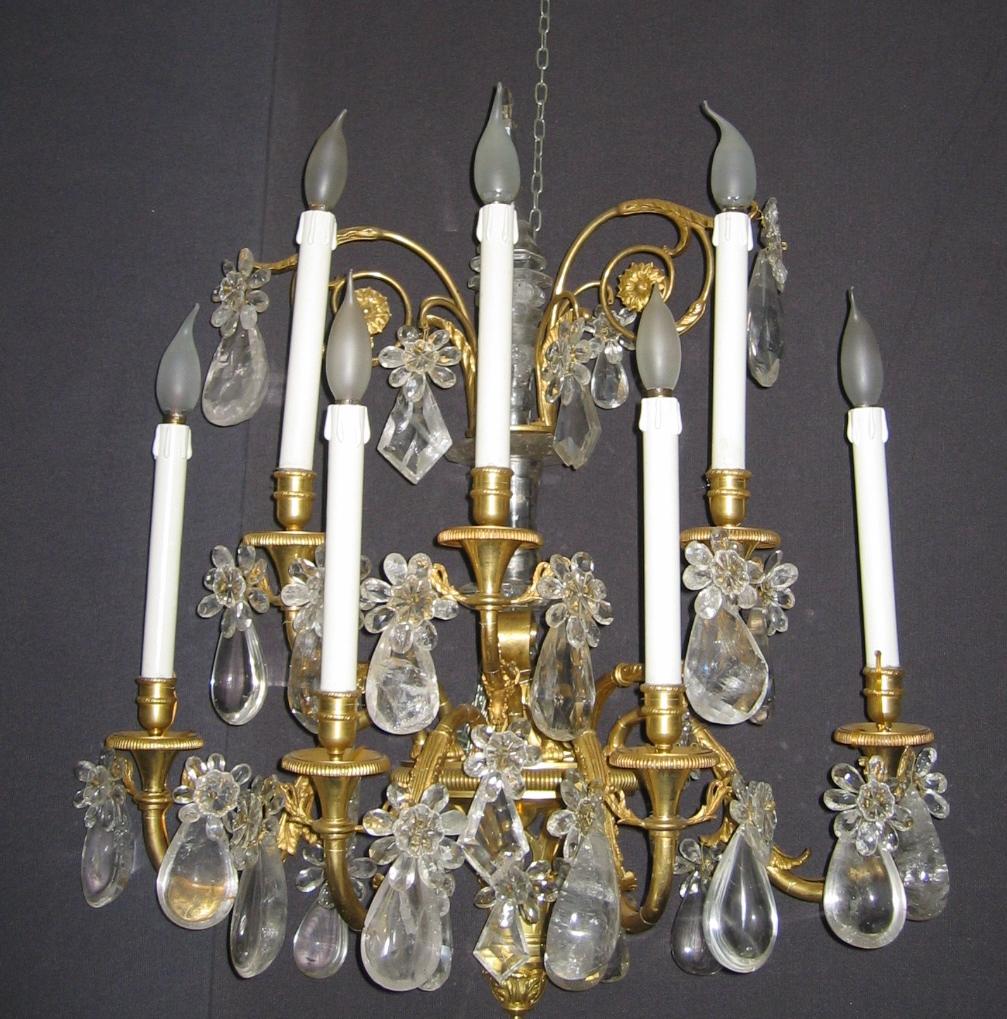 Magnificent pair of French gilded bronze seven branch wall lights with rock crystal drops.
Seven scrolled finely chiseled arms on two levels.
Available three pairs.
Provenance from an Aristocratic Roman Palace.

Measurements: cm 80 x 70 x