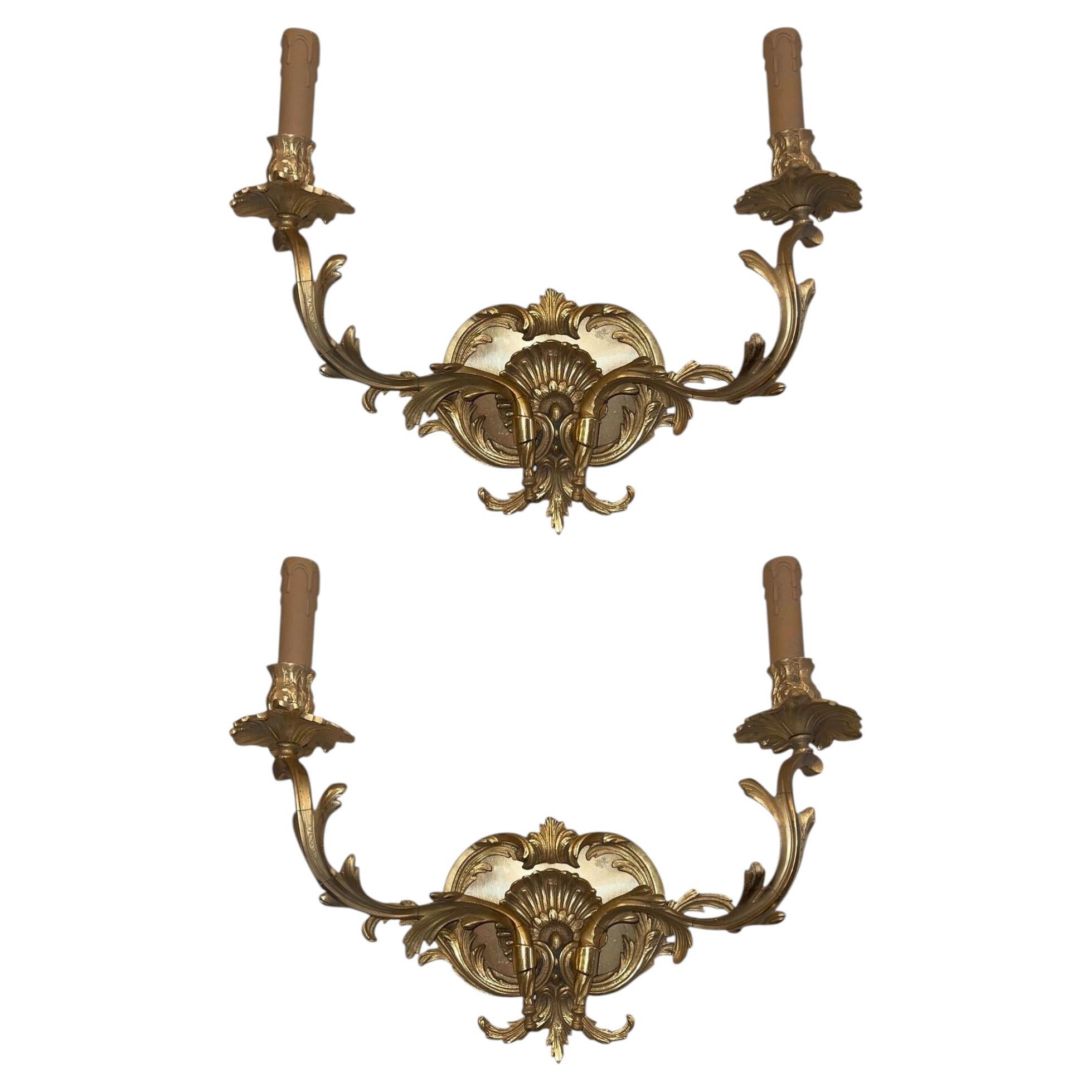 Pair of French Gilt Bronze Louis XV Style Two-Light Wall Sconces. 20th Century. For Sale