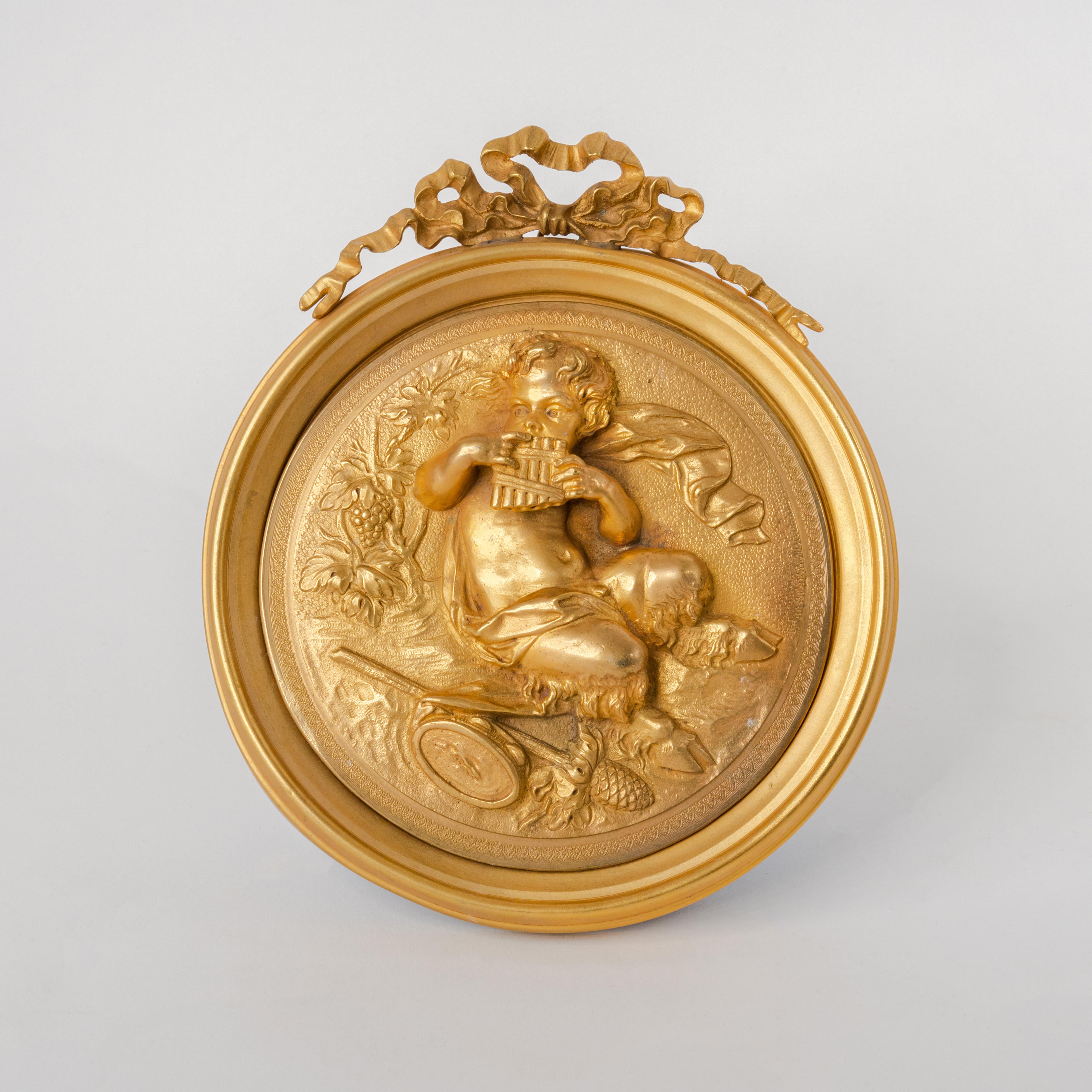 Pair of French gilt bronze round figural wall plaques, France, 19th century 
Attributed To F. Barbedienne

Measures: 10
