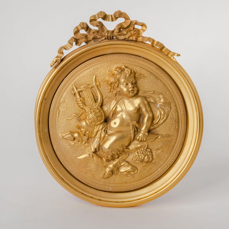 Pair of French Gilt Bronze Round Figural Wall Plaques, France, 19th