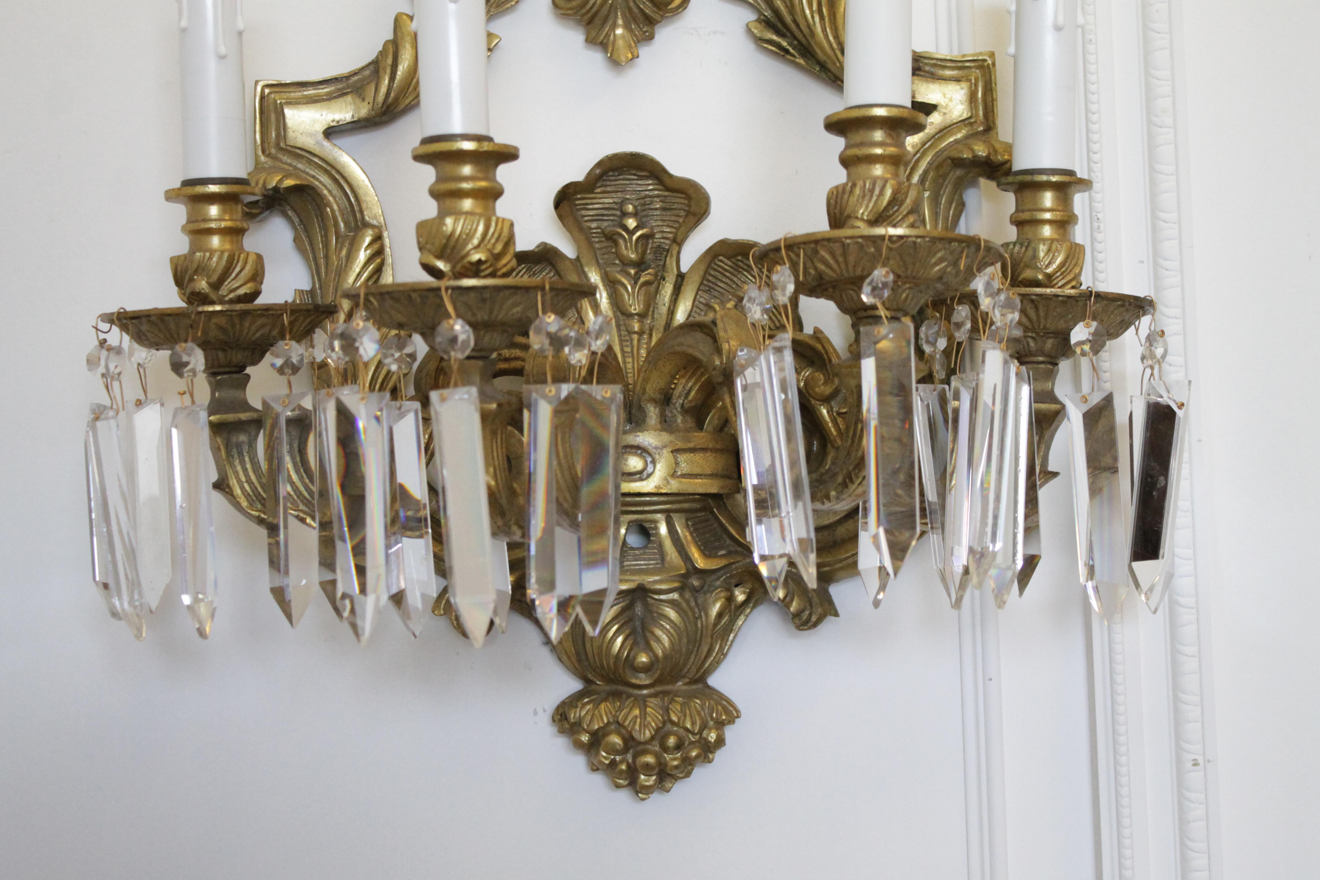 Pair of French gilt bronze sconces with crystals
Measures: 17