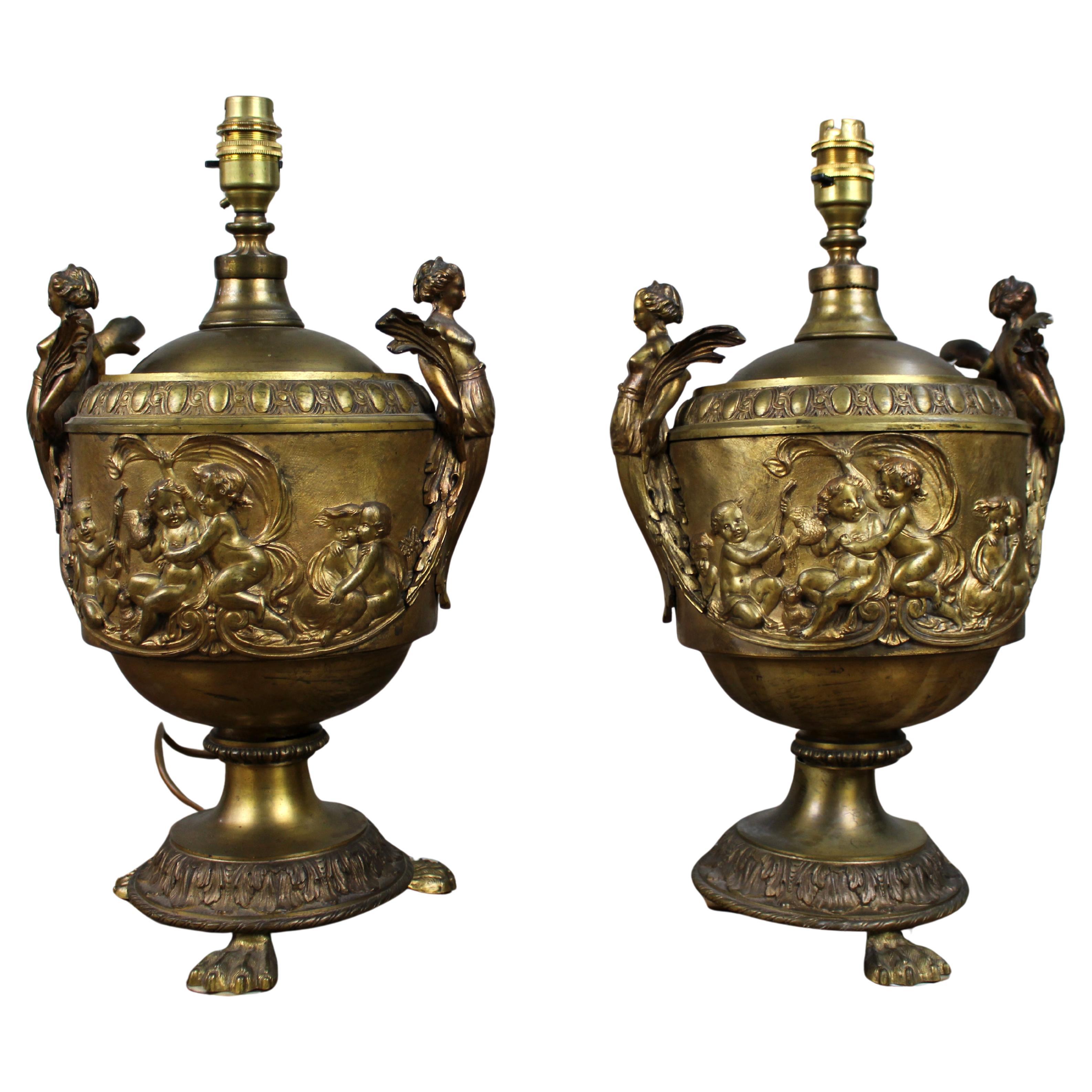 Pair of French Gilt Bronze Urn Lamps with Putti Reliefs, circa 1900 For Sale