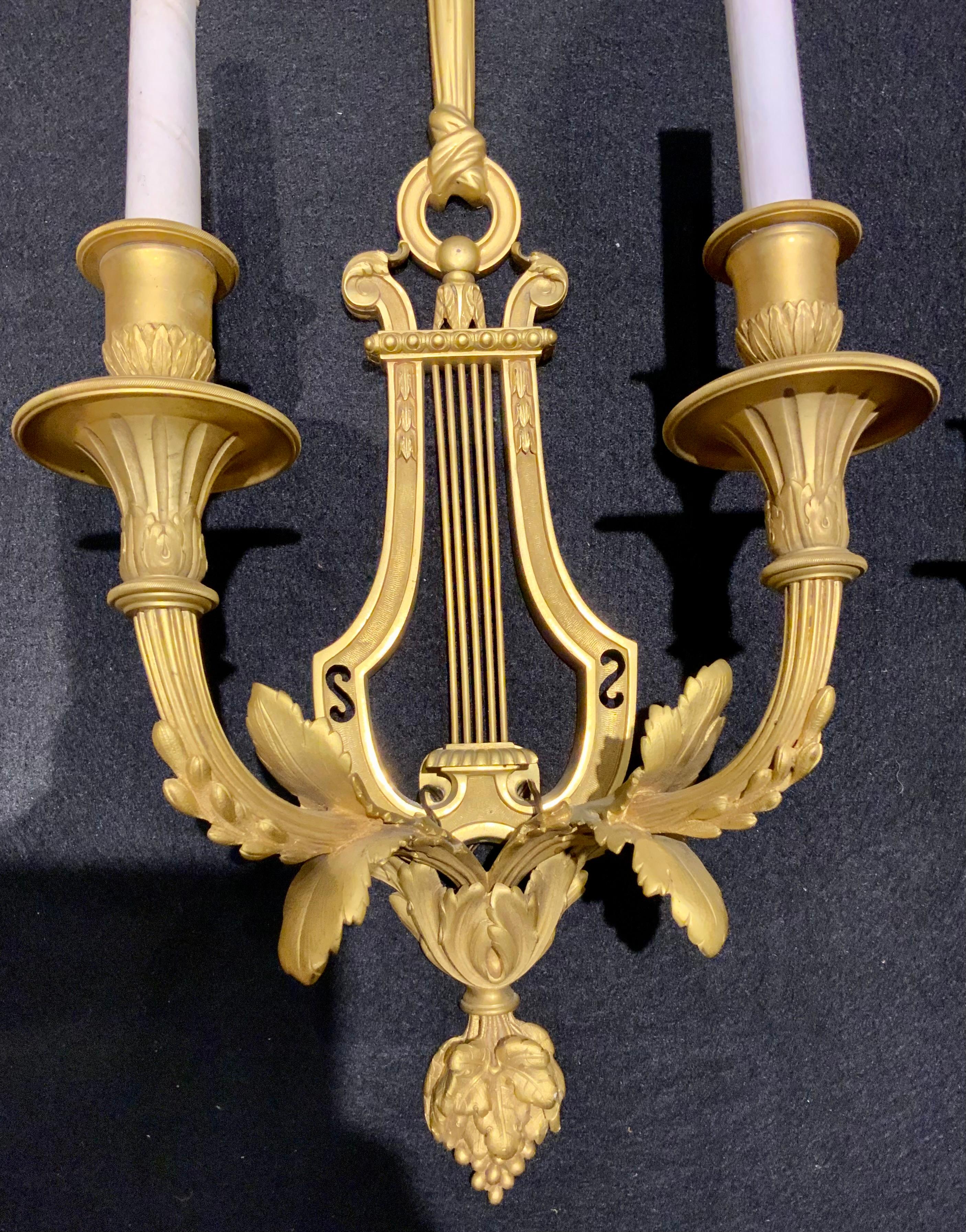 Gilt Pair of  French gilt bronze wall sconces with two lights, 19 th c. For Sale