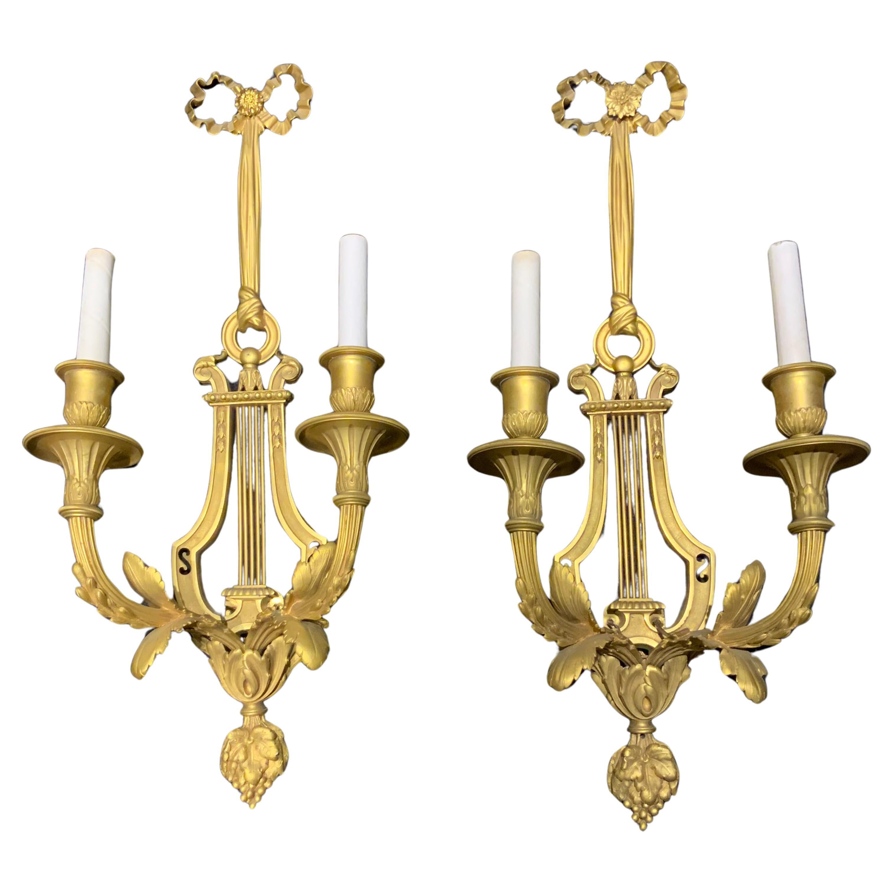 Pair of  French gilt bronze wall sconces with two lights, 19 th c. For Sale
