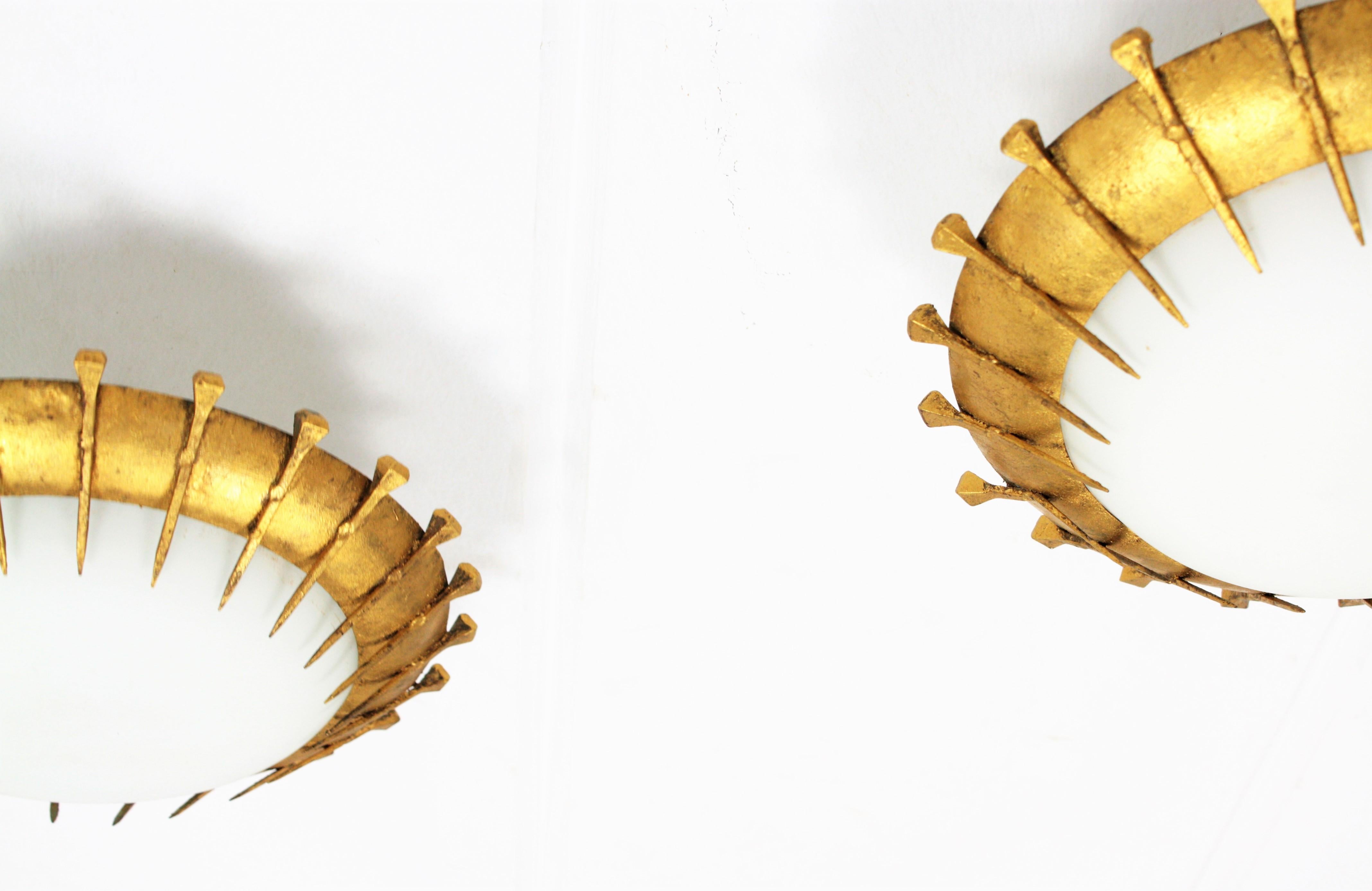 Pair of French Gilt Iron Milk Glass Sunburst Light Fixtures with Nail Accents For Sale 2