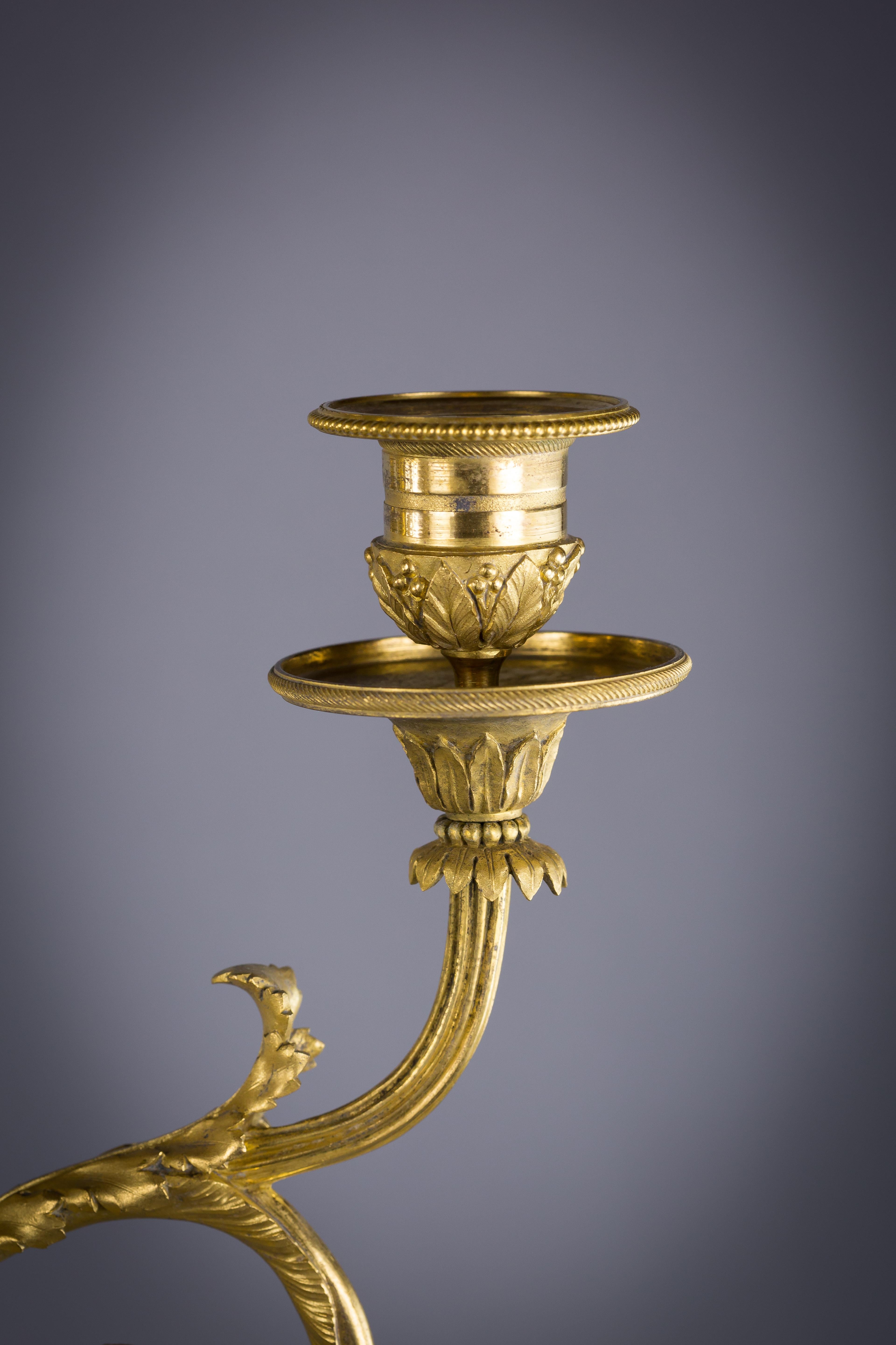 Pair of French gilt and patinated bronze and marble figural candelabra, circa 1860.