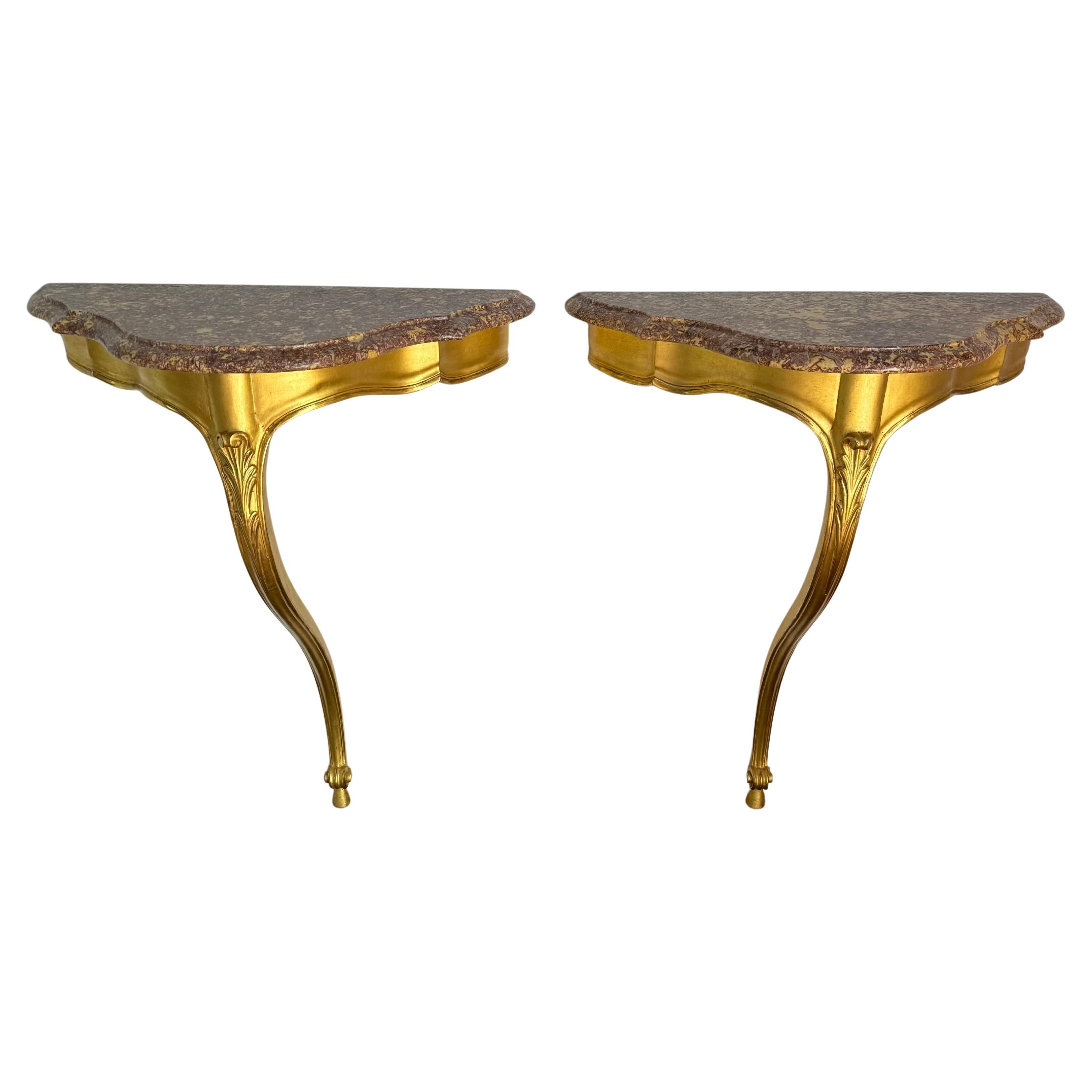 Pair of French gilt wood and marble consoles