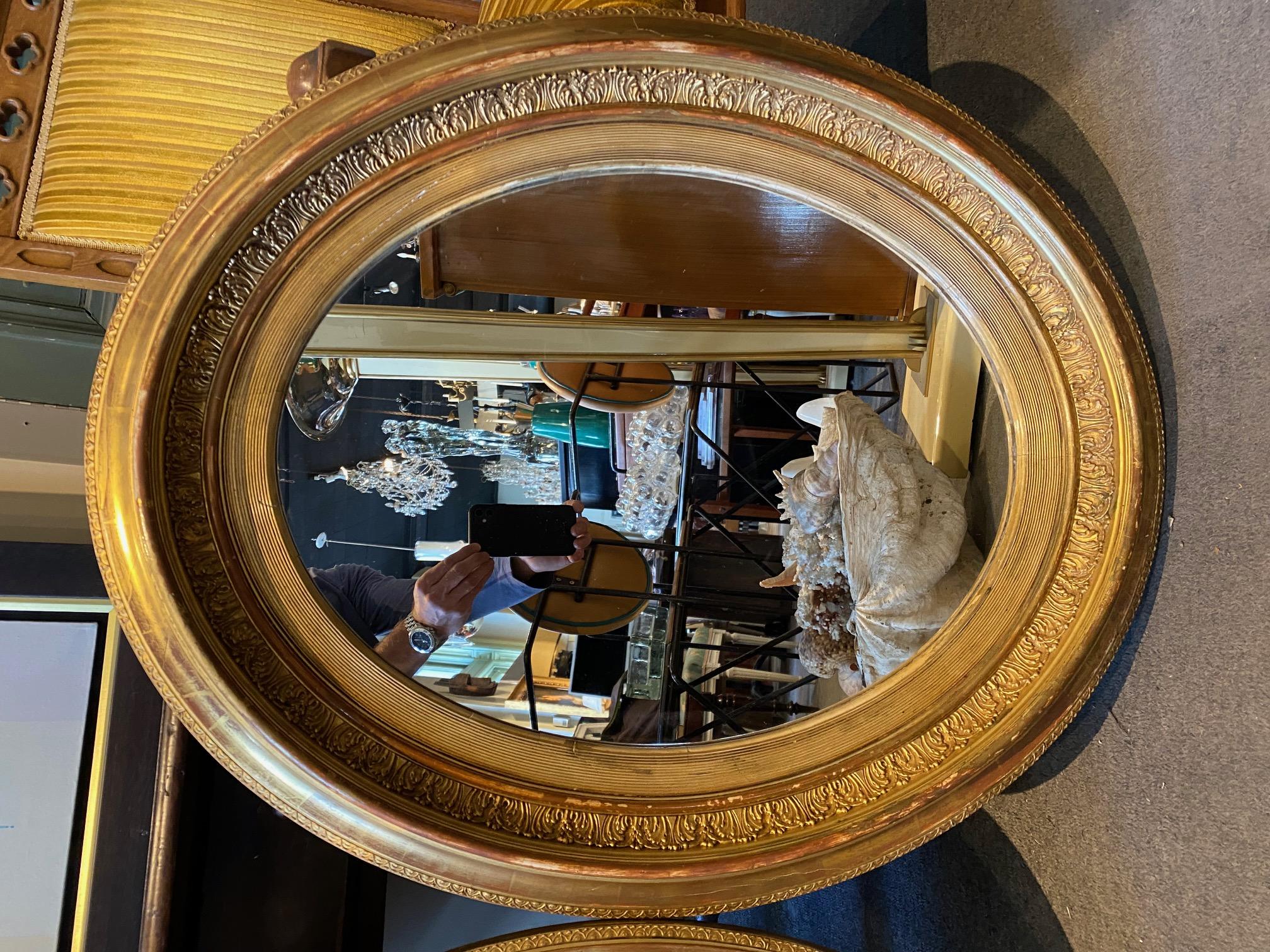 Mid-19th Century Pair of French Giltwood Napoleon III Oval Mirrors