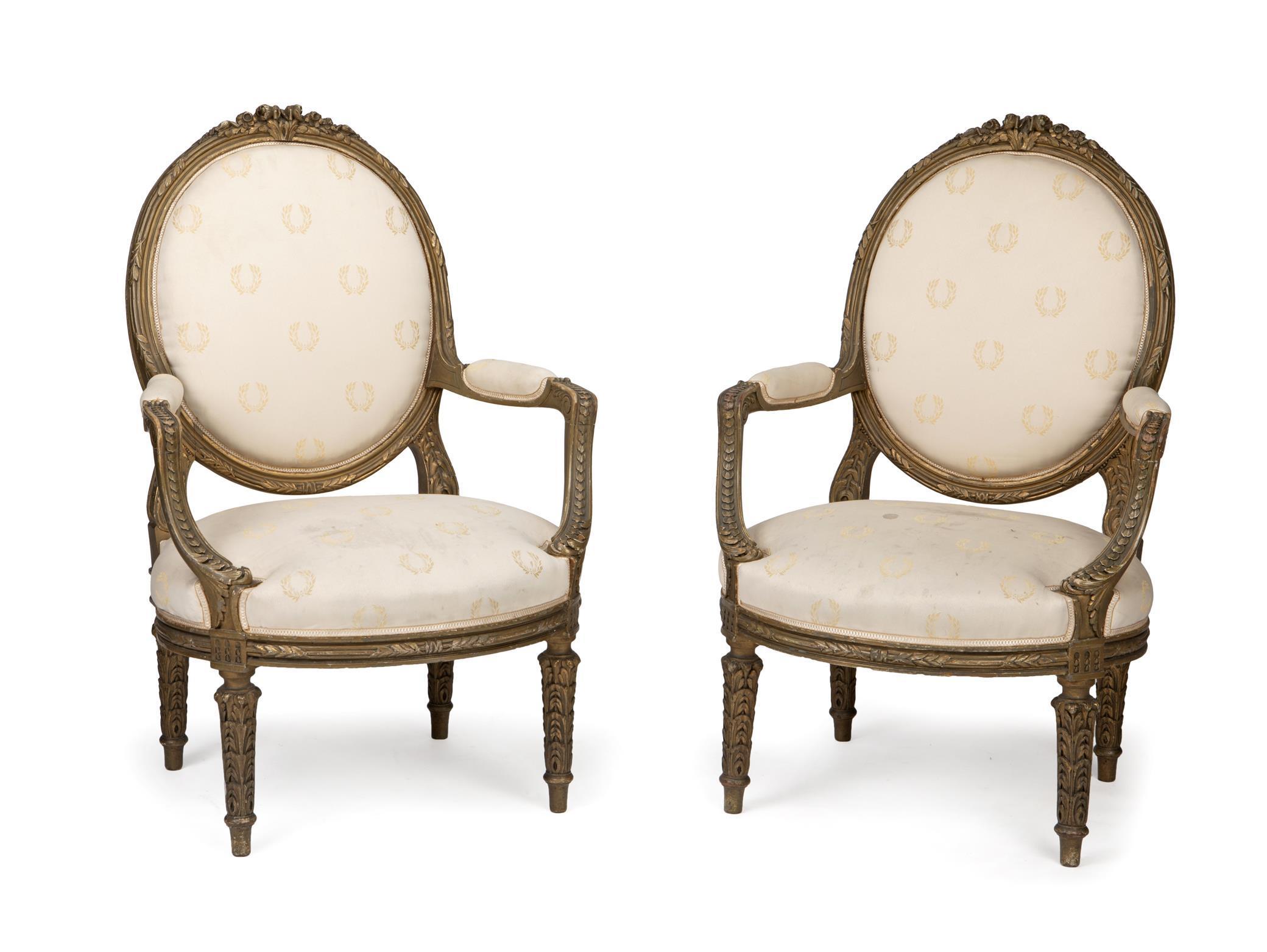 Exquisite pair of French Louis XVI style greenish giltwood fauteuils armchairs. Late 19th/early 20th century.
Each with a rounded foliate inspired greenish giltwood backrest, above two padded armrests, with upholstered seat cushion into a carved