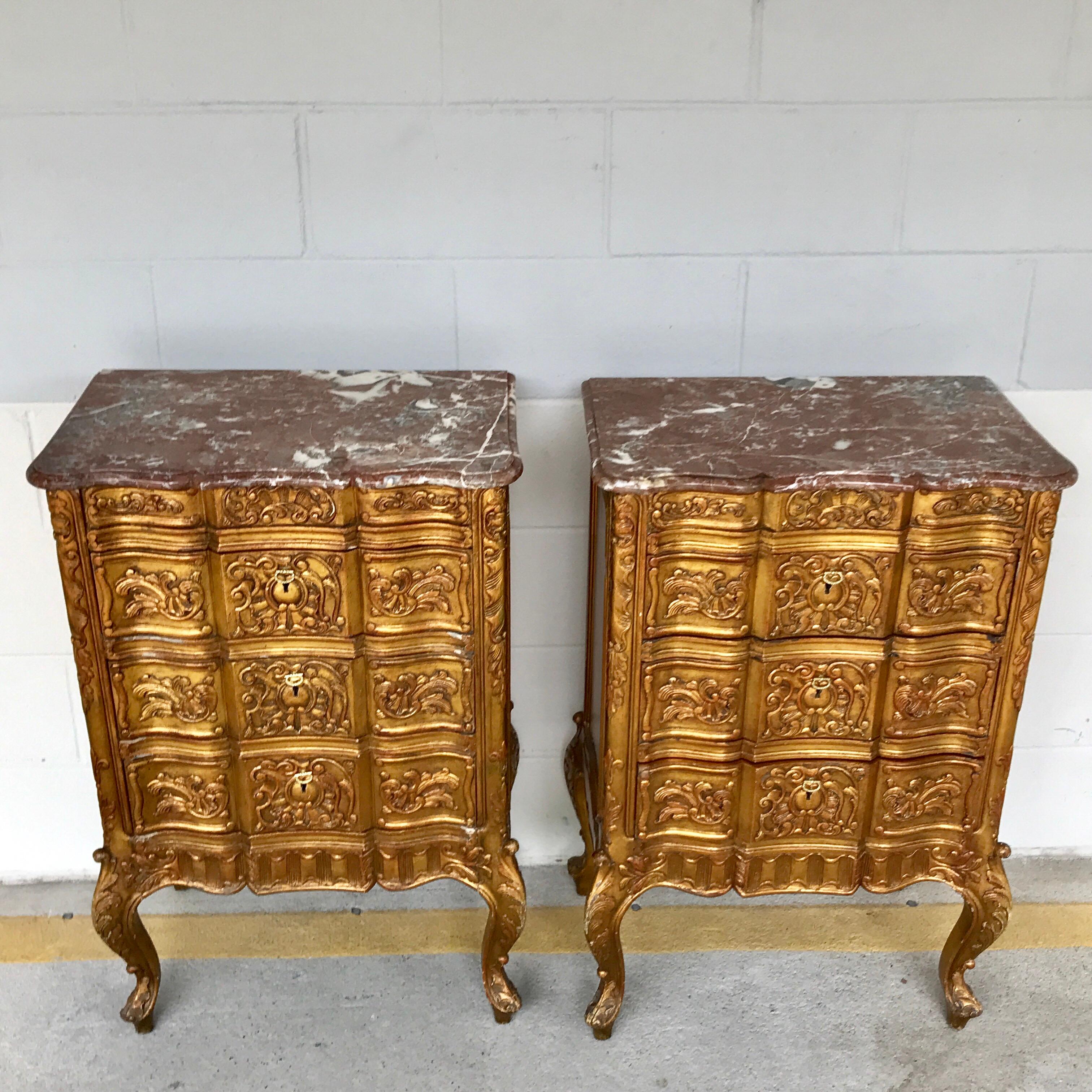 Pair of French giltwood diminutive marble-top commodes, each one with scalloped rose marble tops, over a three 18.5