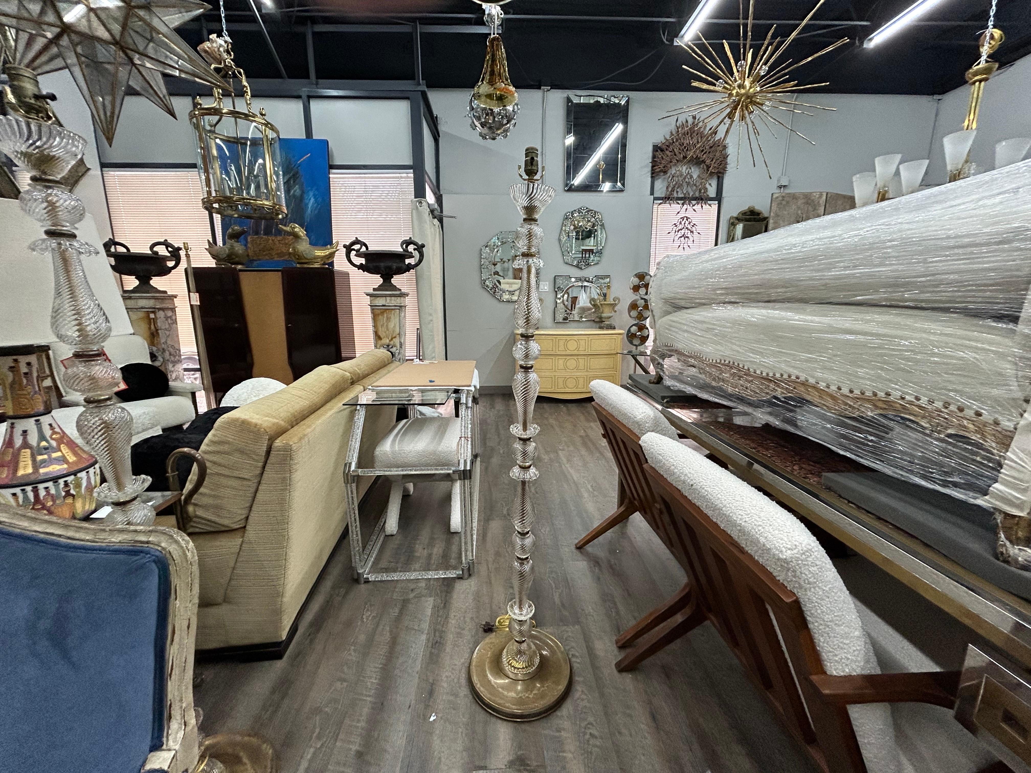 Pair of French glass and brass floor lamps.
This lovely pair of matching French glass and brass floor lamps date to the 1920's and have been newly wired with new sockets for the U.S. market.
These beautiful French floor lamps are ready for the shade
