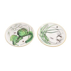 Pair of French glazed faience plates with scallions and artichokes, c. 1850's