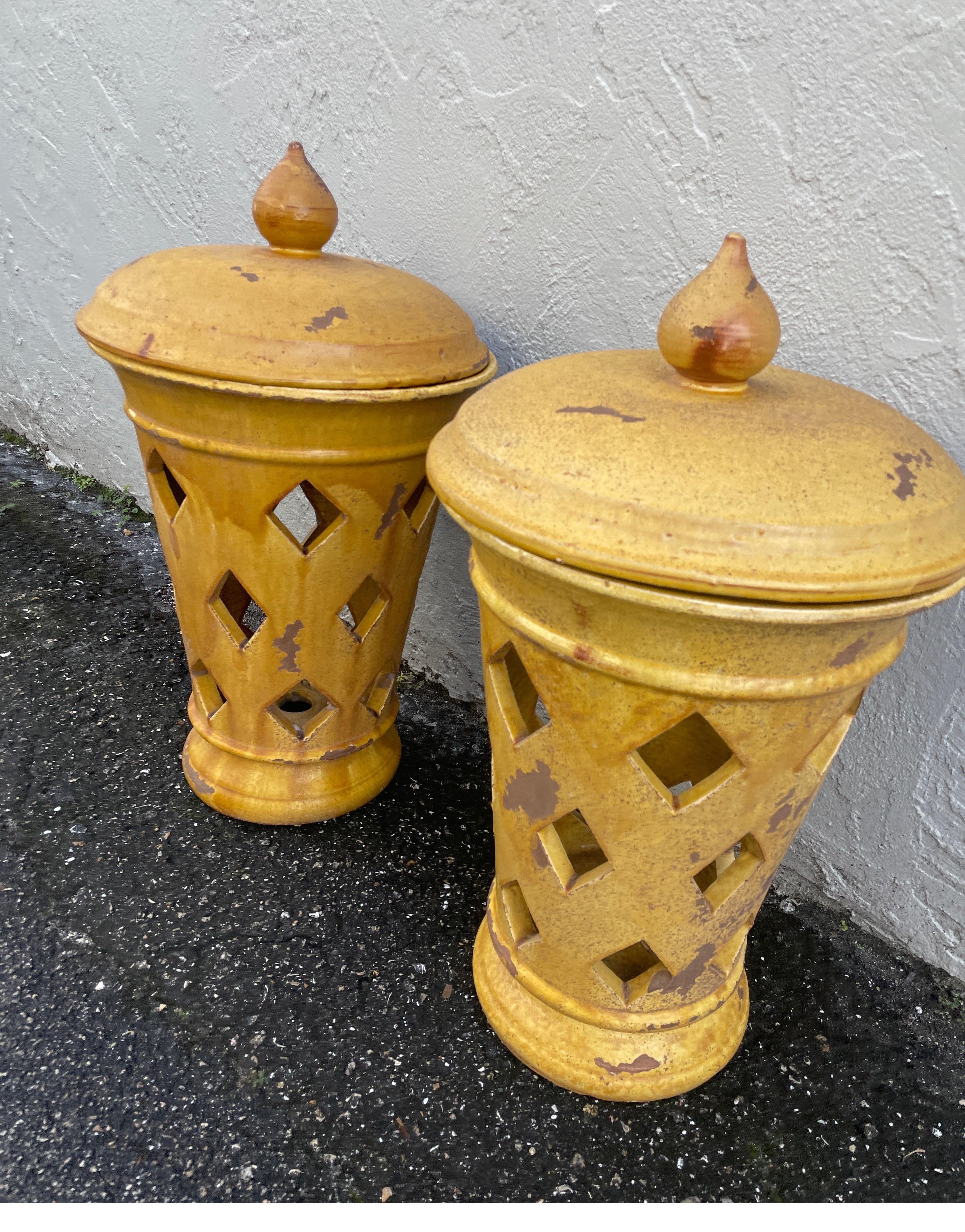This pair of glazed terra cotta table lanterns can be used as is or easily adapted to electricity. They are stamped inside with the makers mark. Quite striking in any garden setting, loggia or family room.