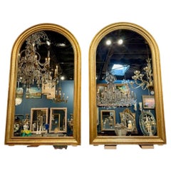 Pareja de espejos franceses dorados con tapa de arco Louis Philippe