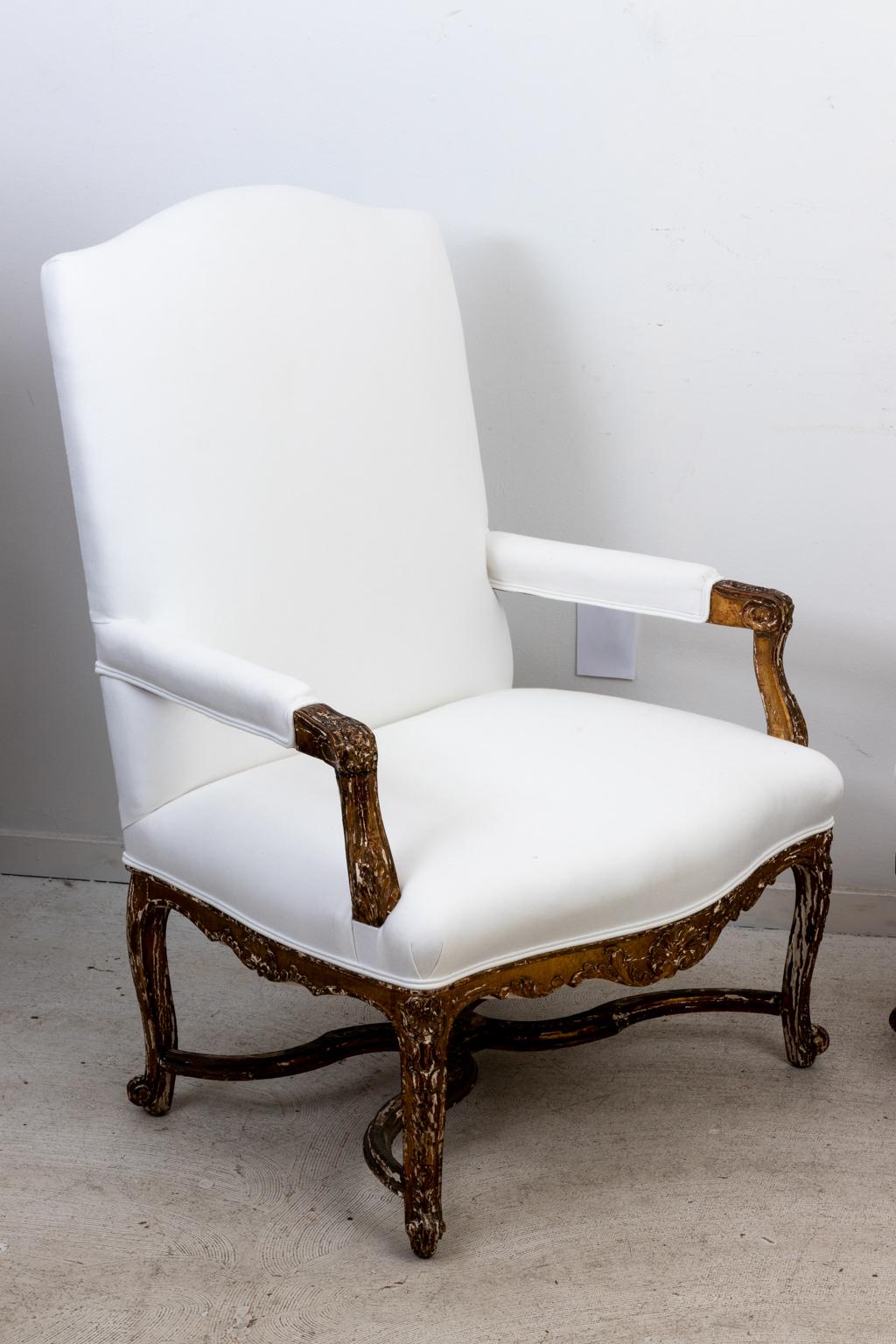 Circa 1860s pair of 19th century Louis XV style carved armchairs that have been freshly upholstered. Made in France. Please note of wear consistent with age.
