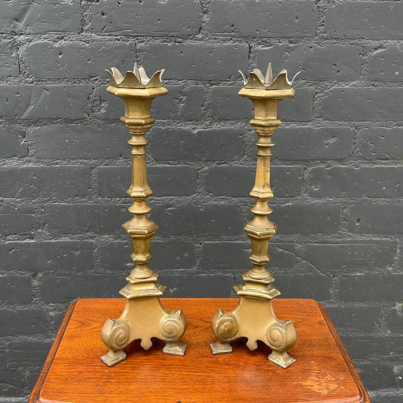 Pair of French Gothic Brass Candle Stick Holders 

Country: French
Materials: Gold Leaf Gilded Wood
Style: French Antique
Year: 1950s

$450 pair 

Dimensions 
15.50”H x 5”W x 5”D.