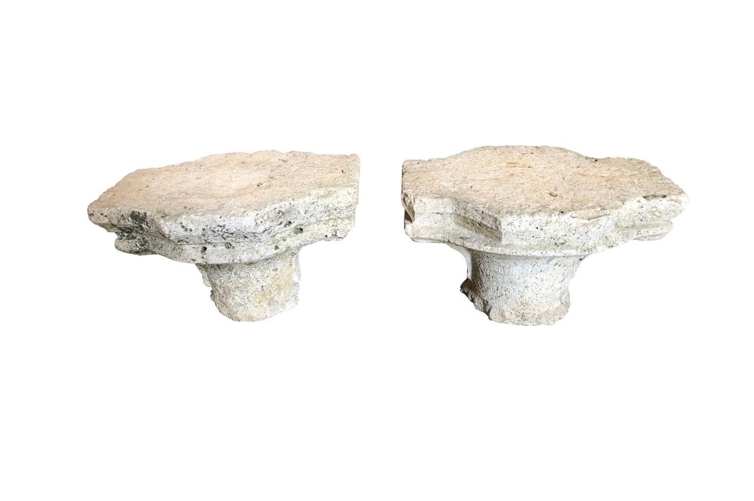 A fantastic pair of Gothic period hand carved stone capitals from the Avignon area of France. Exceptional fragments whether used architecturally or converted into end tables.