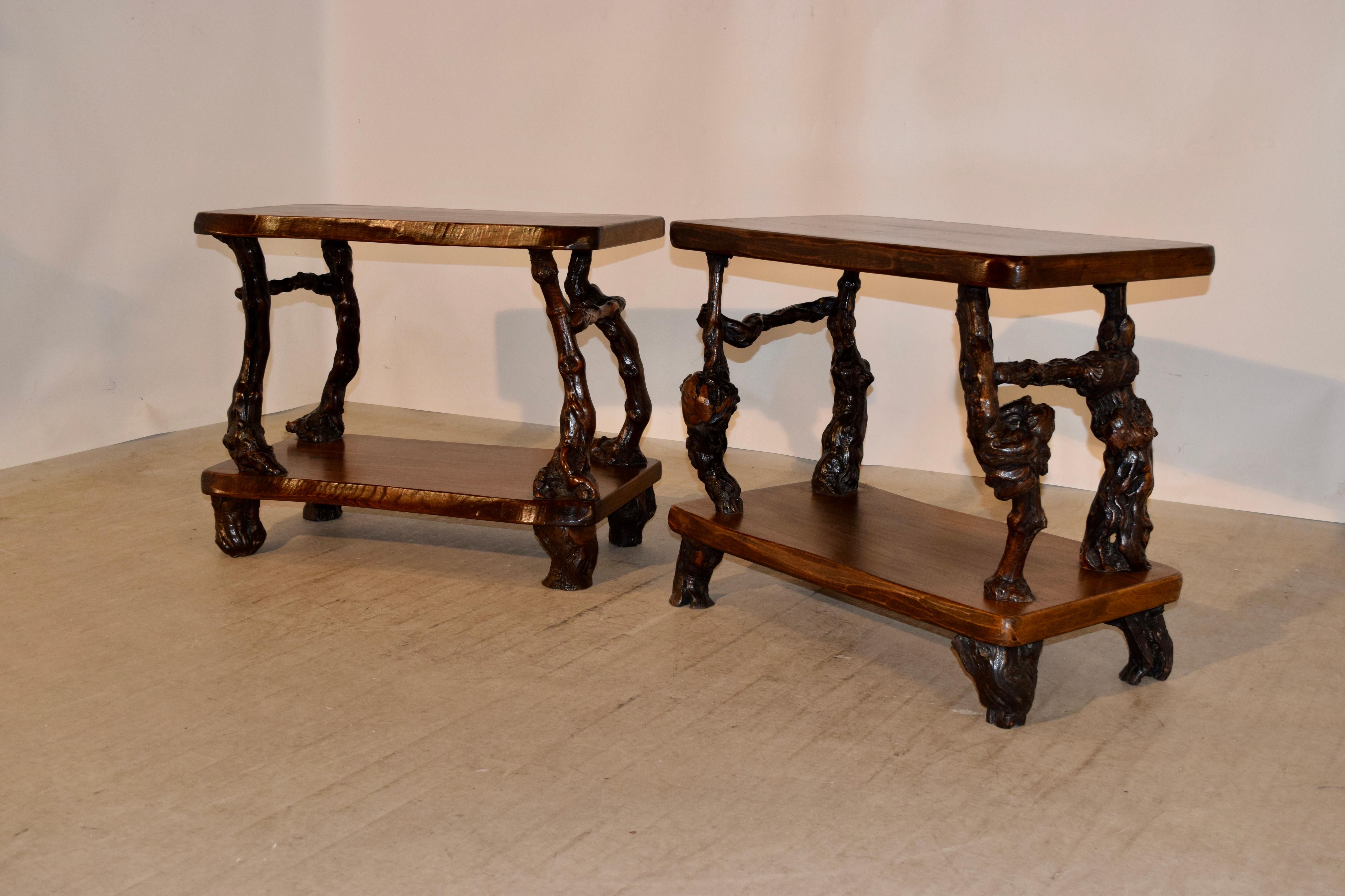 Pair of French tables made from walnut shelves separated by grapevine legs and stretchers, circa 1920s. The feet are also made from grapevines. The second table measures 31.38 H x 17.75 D x 25.75 H.
 