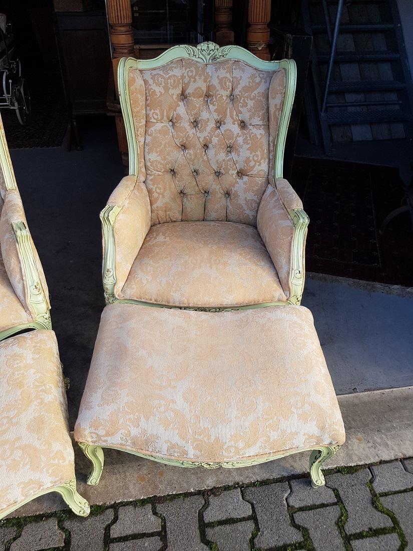 Louis XV Pair of French Green Painted Wingback Chairs with Footstools, Late 20th Century For Sale