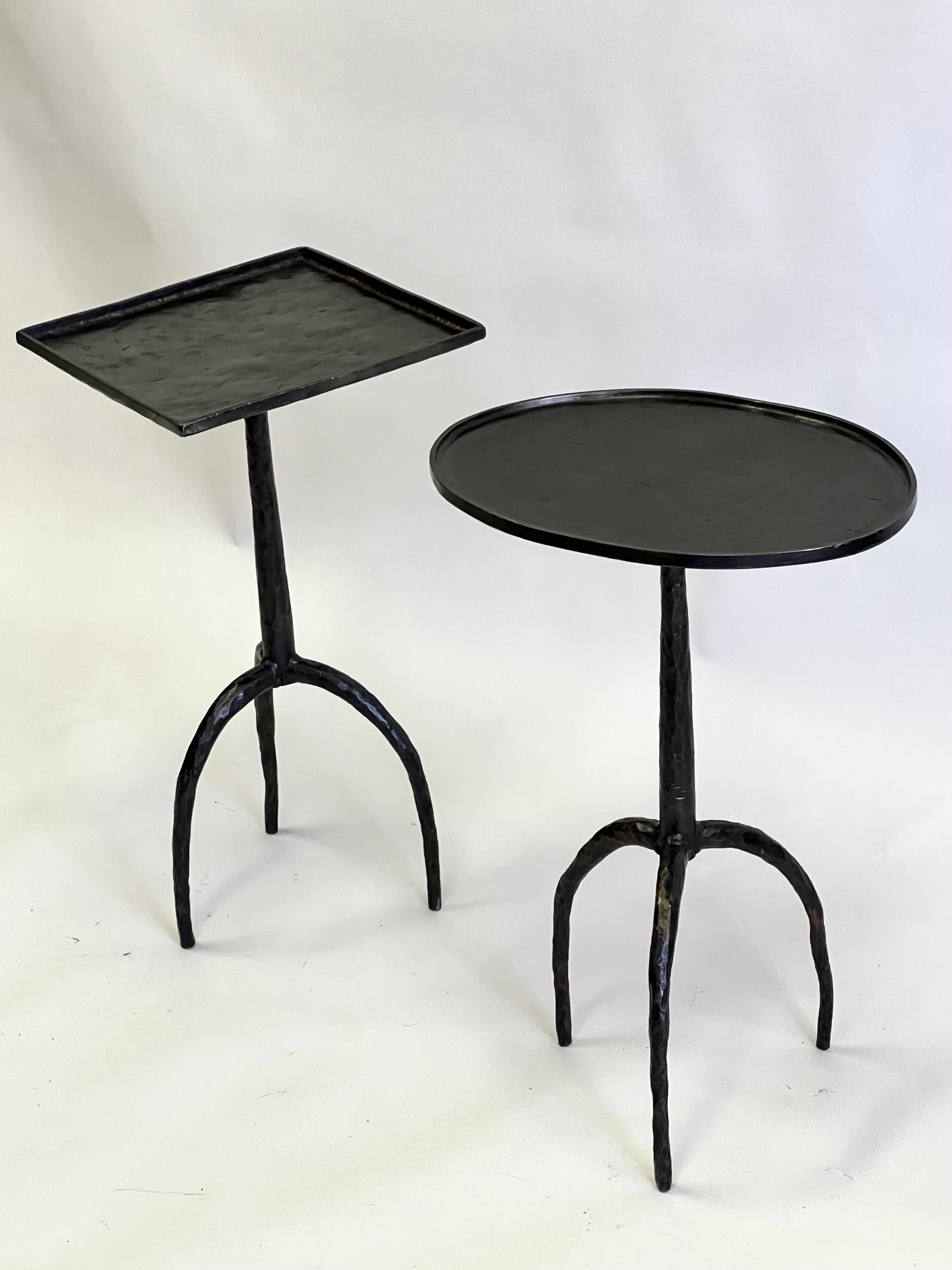 Exquisite and exotic pair of French Hand Hammered Wrought Iron Side Tables in the style of Alberto and Diego Giacometti. The pieces reflect both modern craftsman and brutalist sensibilities, yet maintain a delicate composure and strong unique
