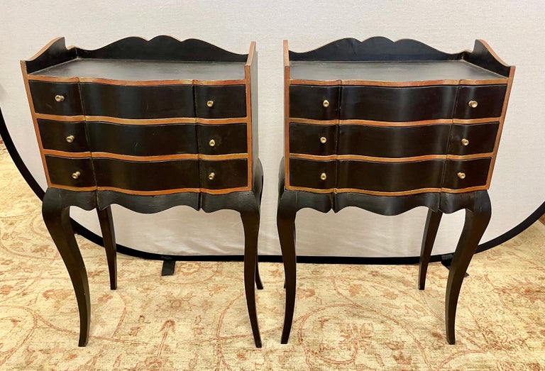 Elegant French Louis XVI style matching nightsands, handpainted in black and gold and featuring three drawers. Why not own the best? Perfect for a bedroom of sitting space.