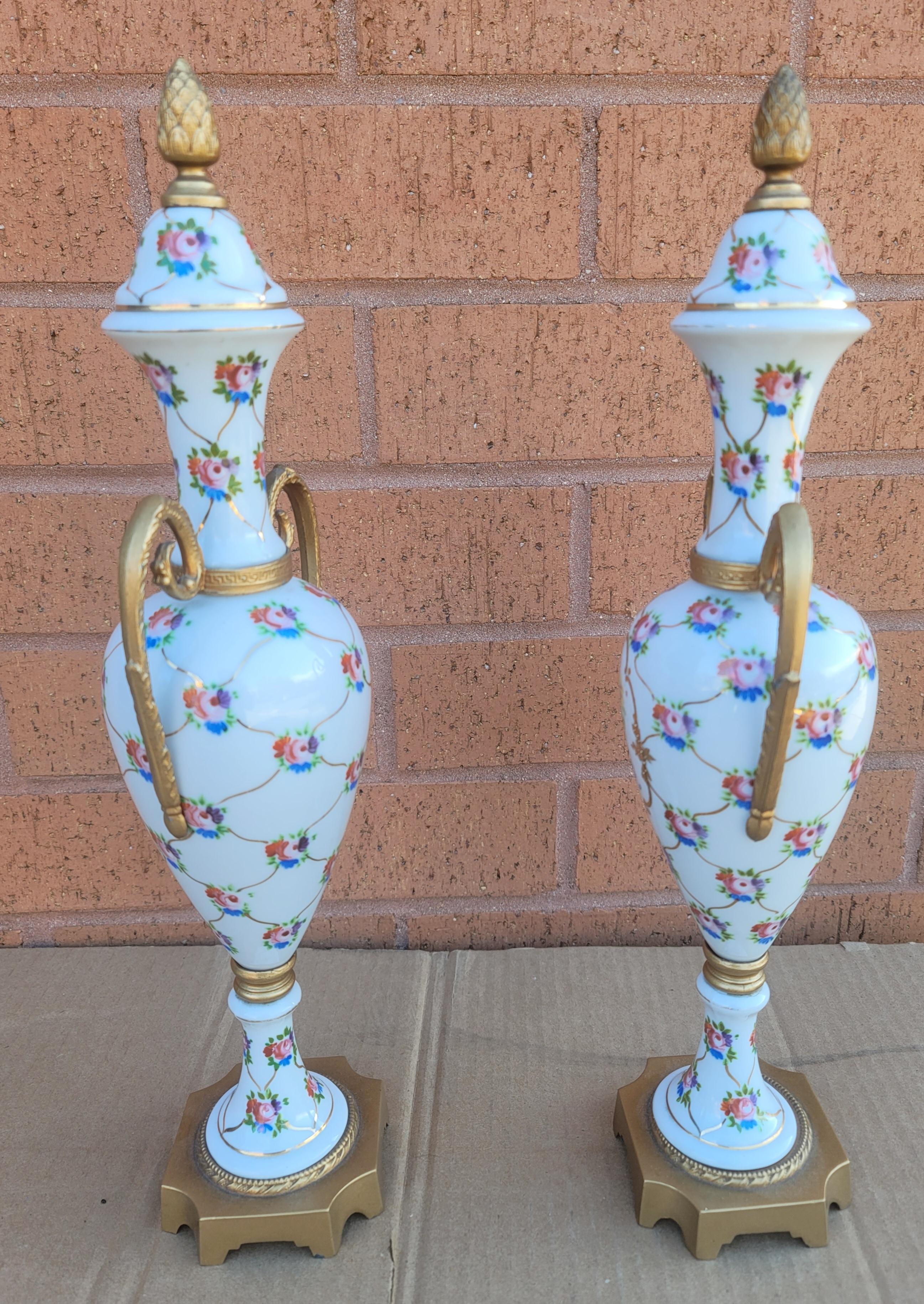 Pair of French Hand-Painted Porcelain and Gilt Metal Amphoras with no chips or cracks. Measure 5