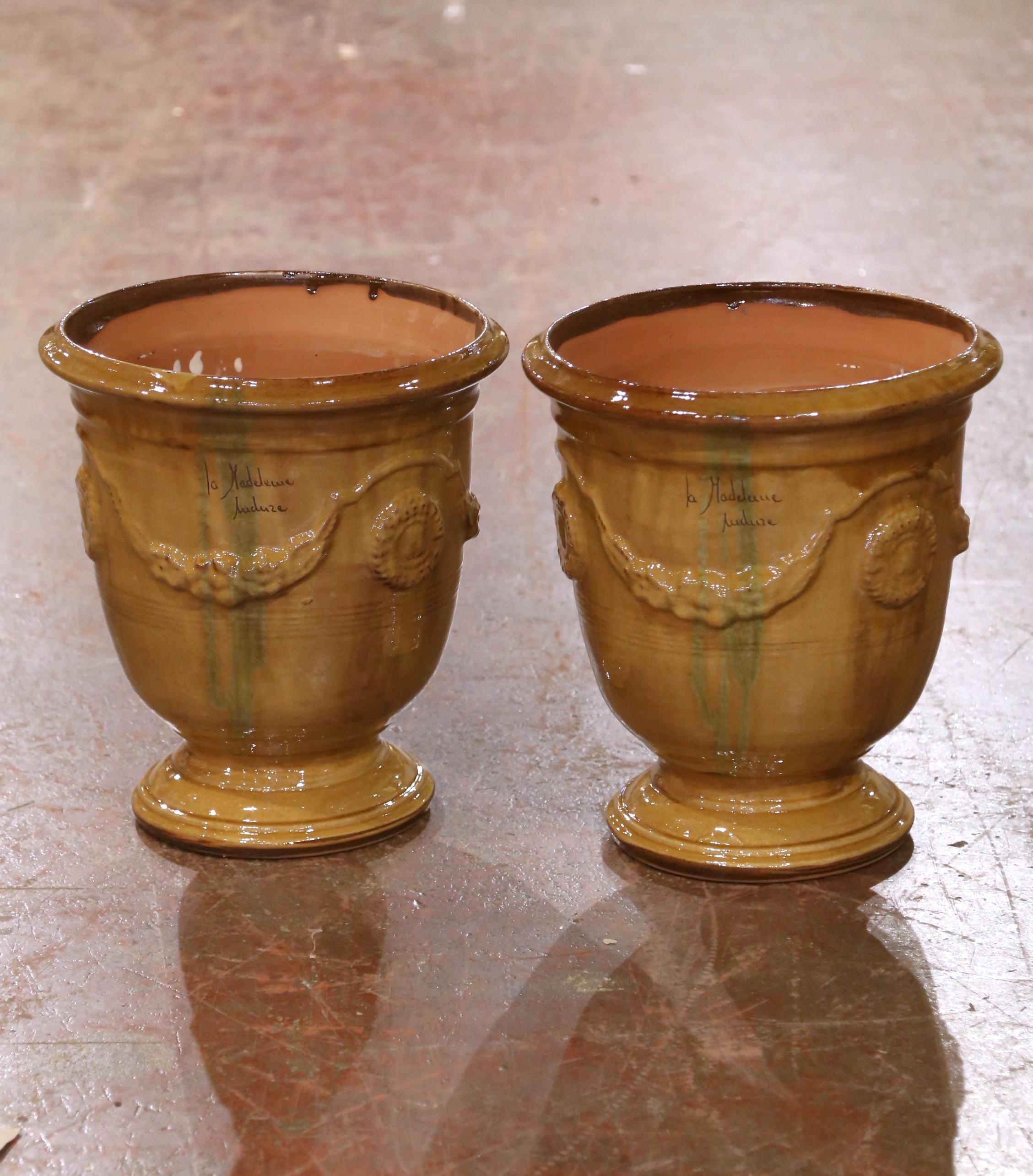 Add timeless Provençal elegance to your garden or interior with this pair of handmade Anduze planters by La Madeleine. Crafted in southern France using traditional techniques, each vessel is formed in terracotta and finished in a lustrous warm