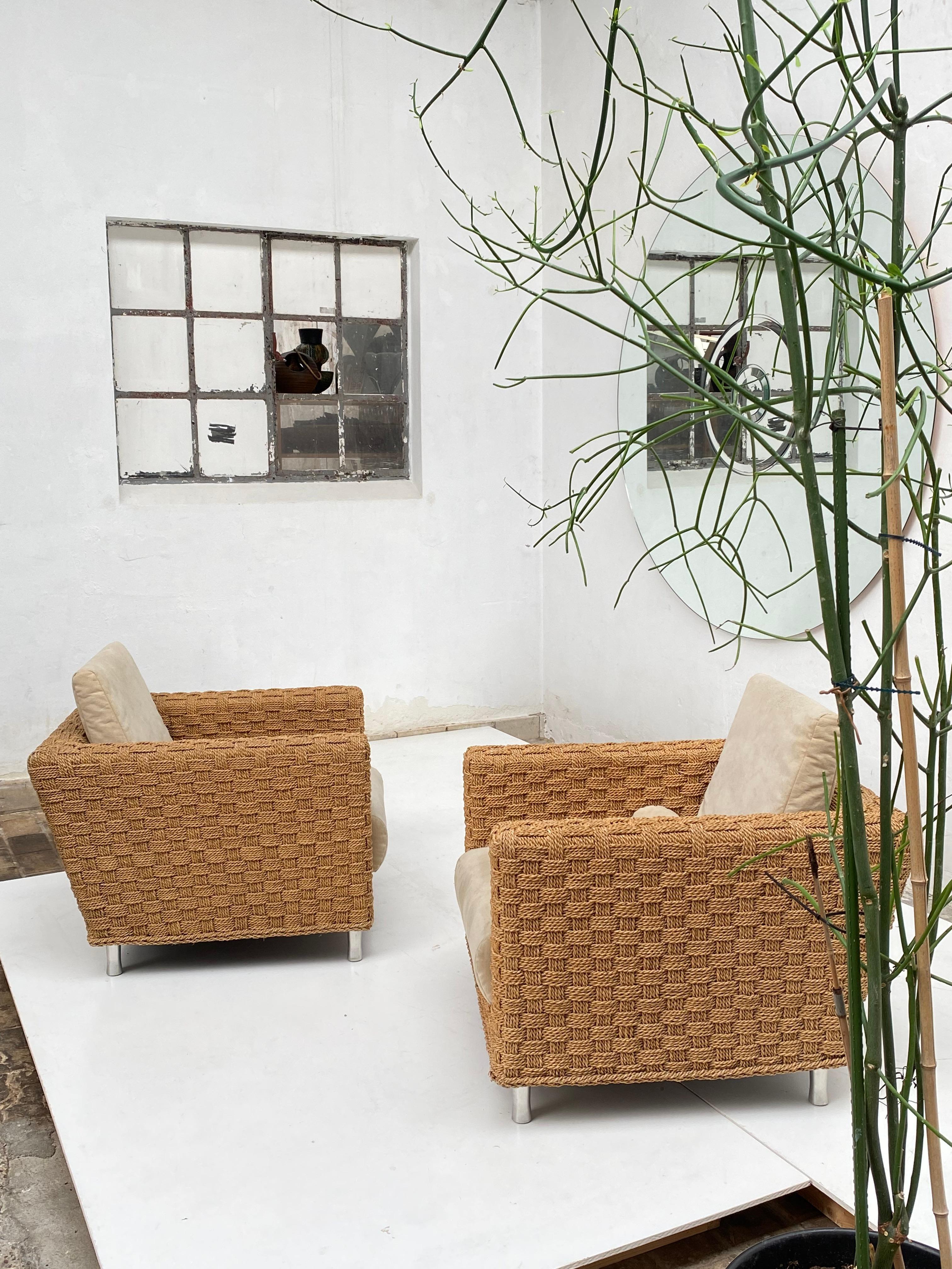 Stunning pair of French Woven Hemp Rope lounge chairs 'Wicky' by Didier Gomez for Ligne Roset France 1990's

Extremely comfortable chair with down filled removable cushions 

The Faux Suede Alcantara fabric can easily zip off and be changed to suit