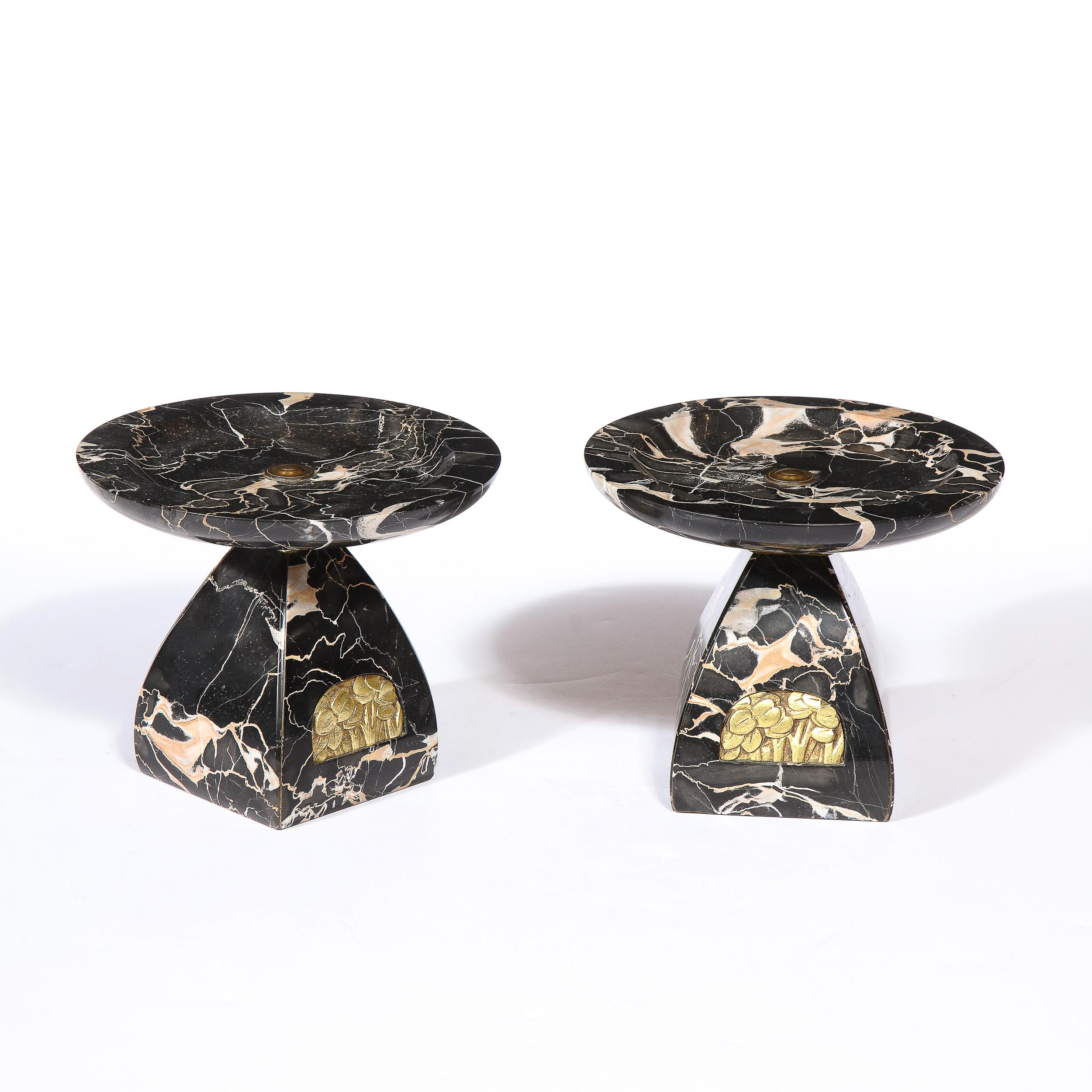 This stunning pair of French High Style Art Deco tazzas were realized in France circa 1930. They feature beveled streamlined bodies that taper at their necks where they adjoin concave tops- all in beautiful black exotic marble with dramatic veining.