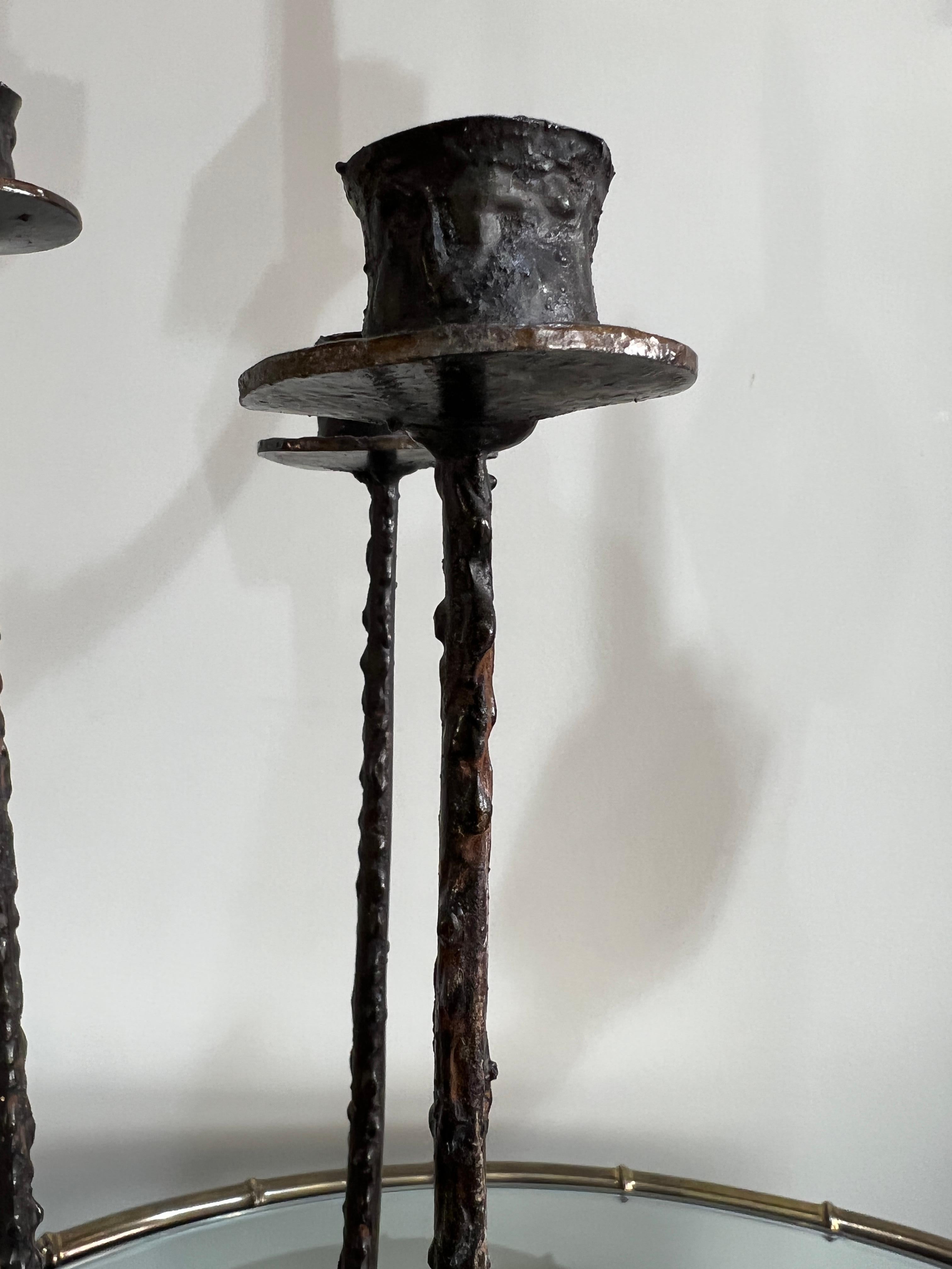 A pair of French brutalist iron candelholders, circa 1970 

Dimensions 
H 47 cm.