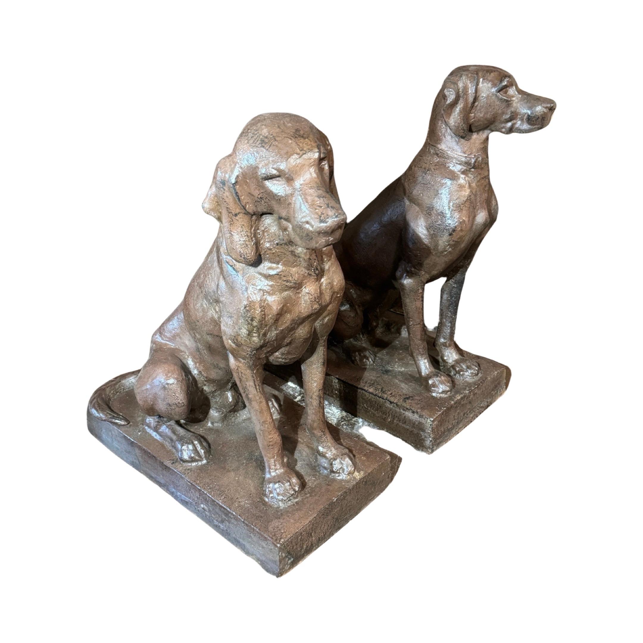 Expertly crafted in France during the 1950s, these French Bronze Dog Sculptures add a touch of sophistication to any space. Made with high-quality iron and finished in a stunning bronze style, these sculptures make a timeless and elegant addition to