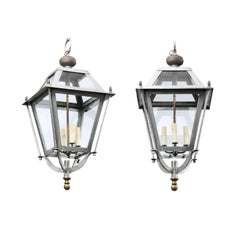 Pair of French Iron Four-Light Lanterns with Glass Panels and Scrolling Accents