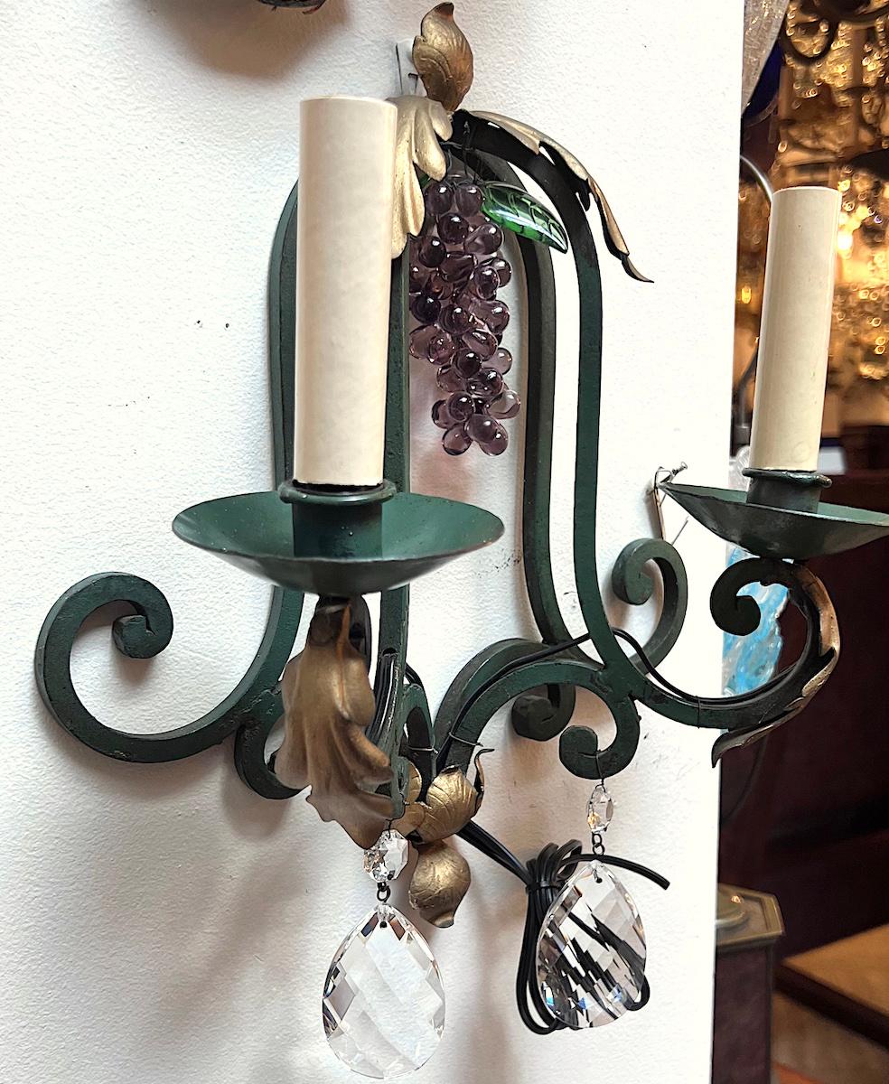 Pair of circa 1930s verdigris sconces with glass grapes pendants and crystal drops.

Measurements:
Height: 13