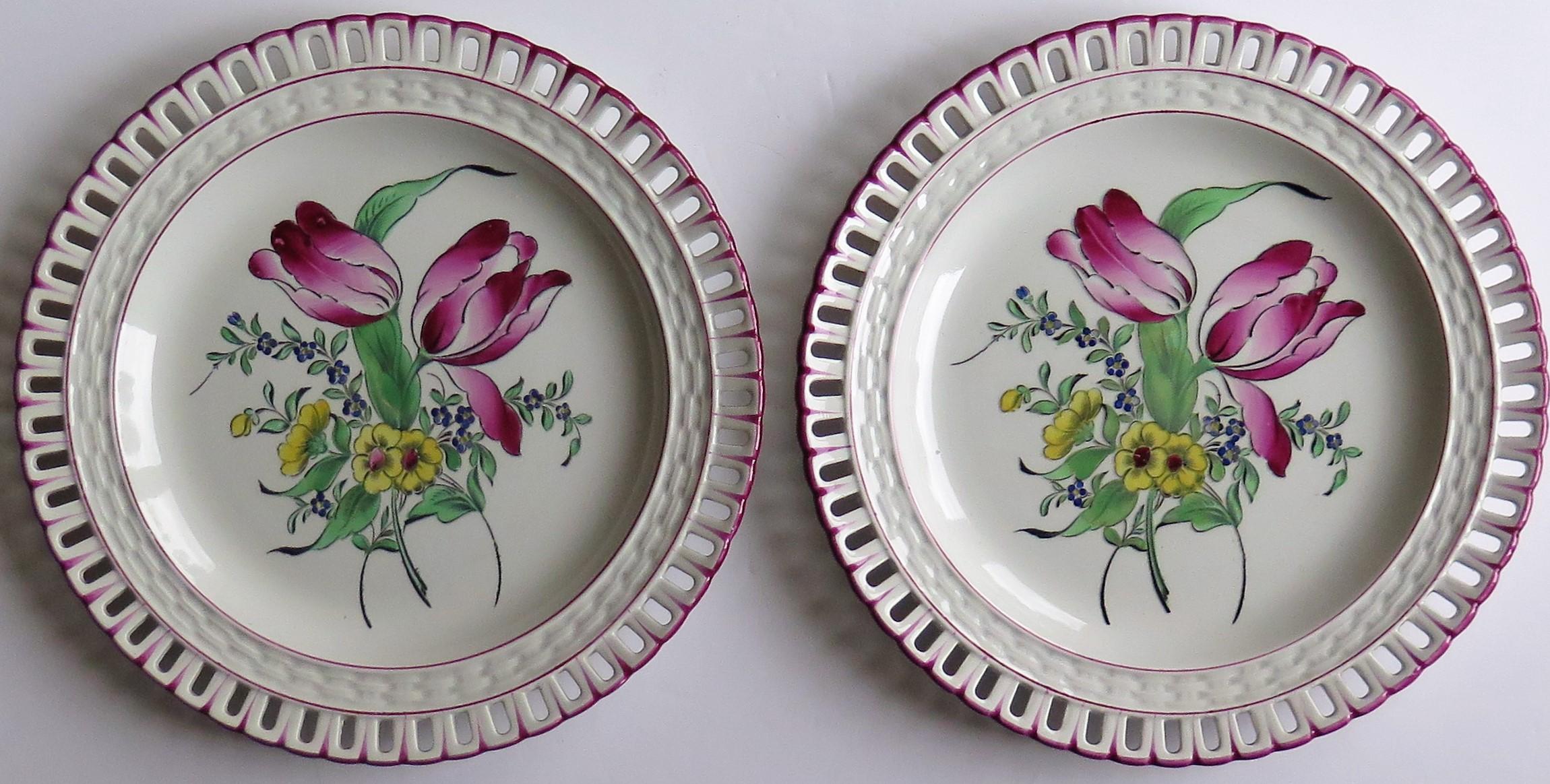 These are a beautiful pair of French Faience dinner plates with pierced rims, made by the Luneville K&G factory and dating to the late 19th century, circa 1895.

These large circular earthenware pottery plates are well potted with pierced