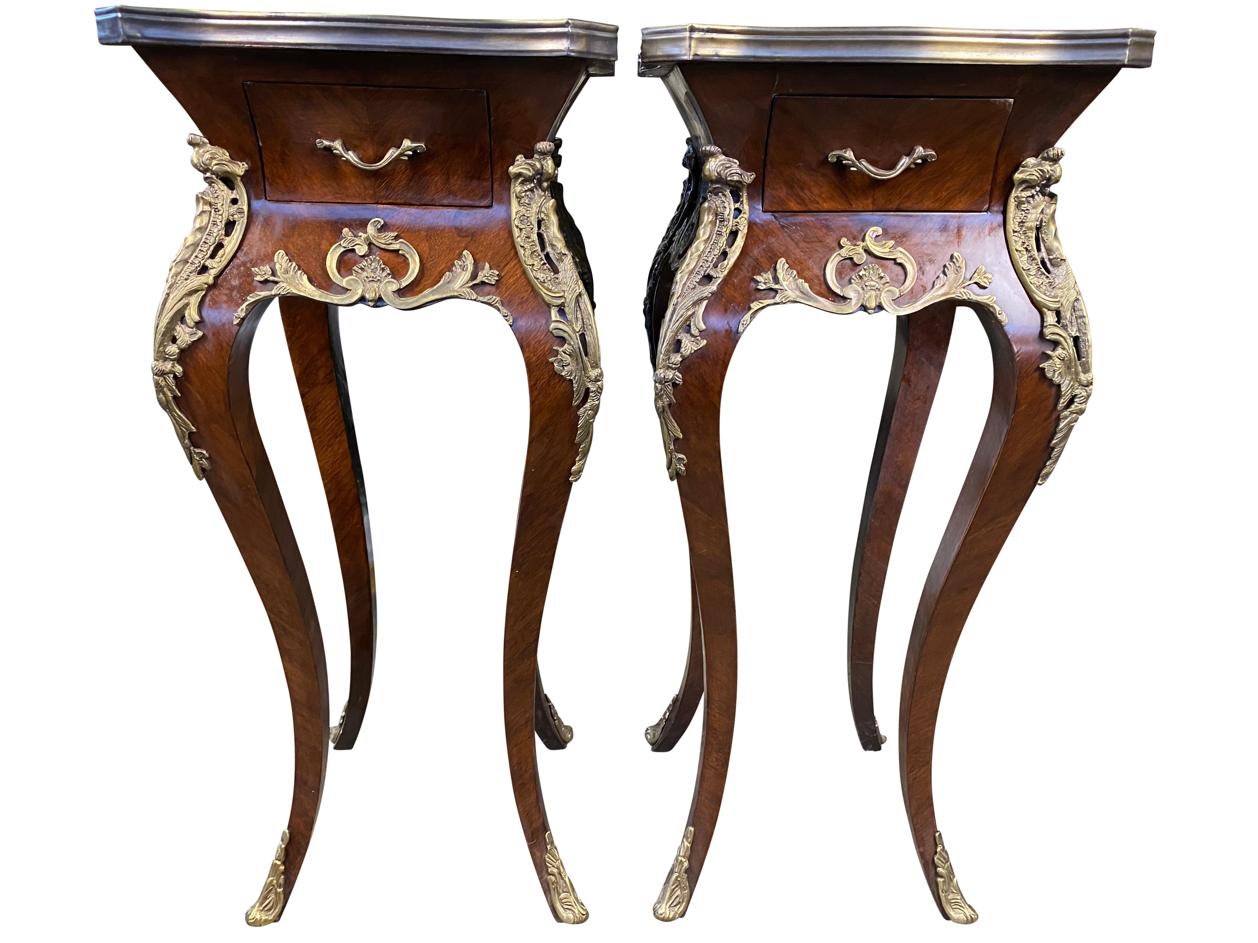 Two incredibly well-crafted French kingwood side tables with beautifully gilded and curved legs. A draw and lavish handle is fitted to each table too. Perfect from home interior.

Dimensions (cm)
80 H, 36 W, 36 D.
